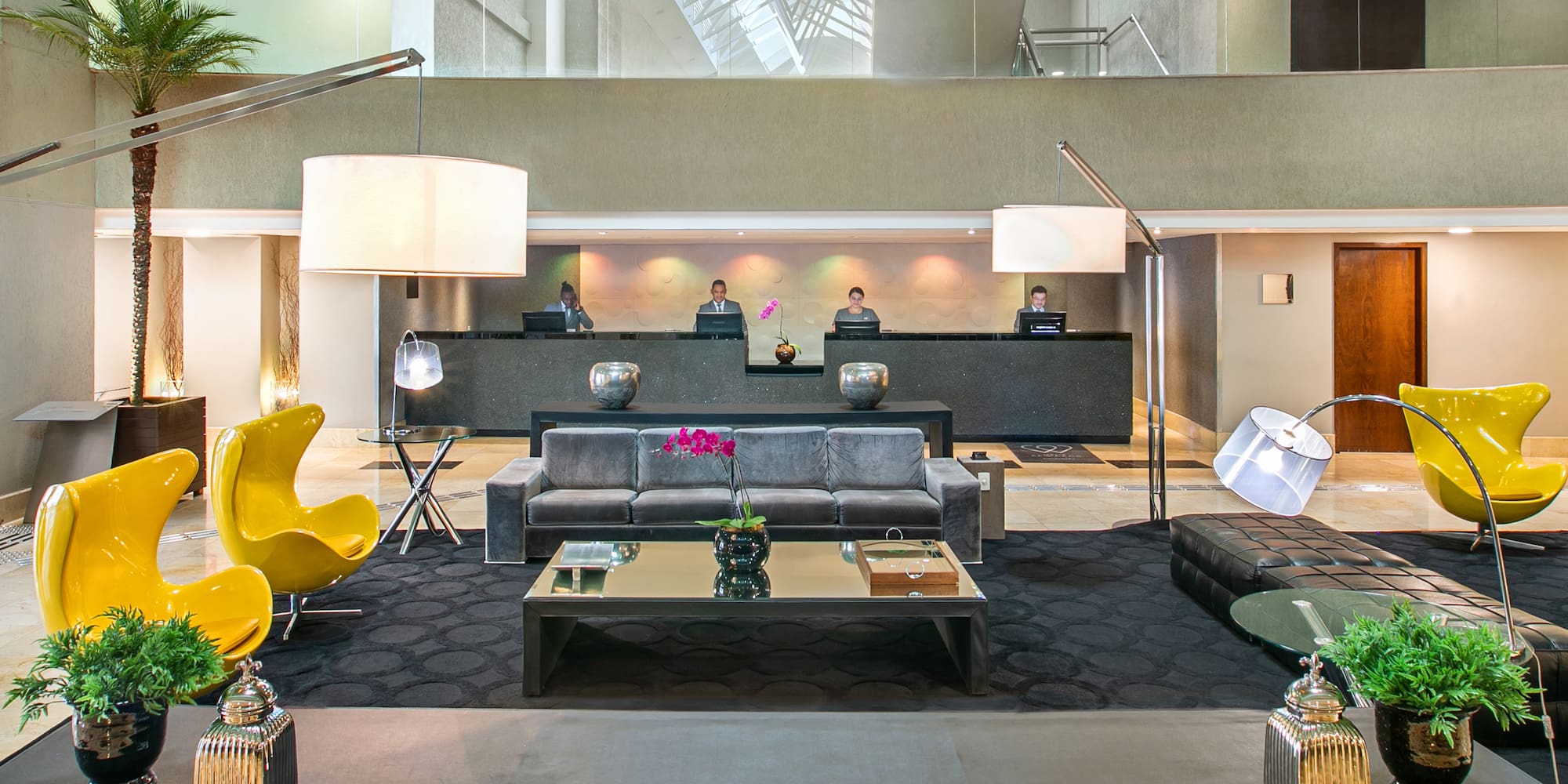 a group of people in a hotel lobby