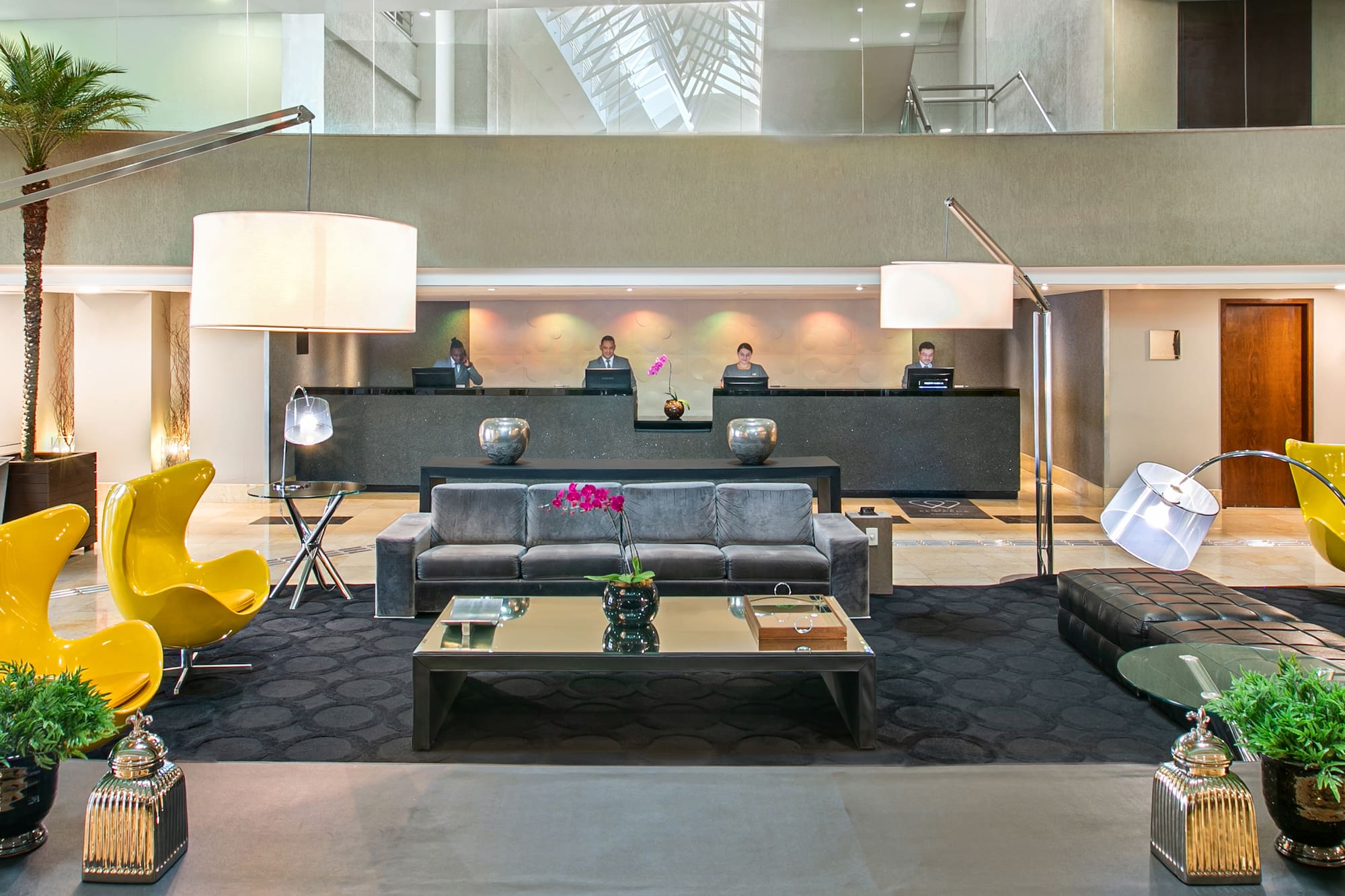 a group of people in a hotel lobby