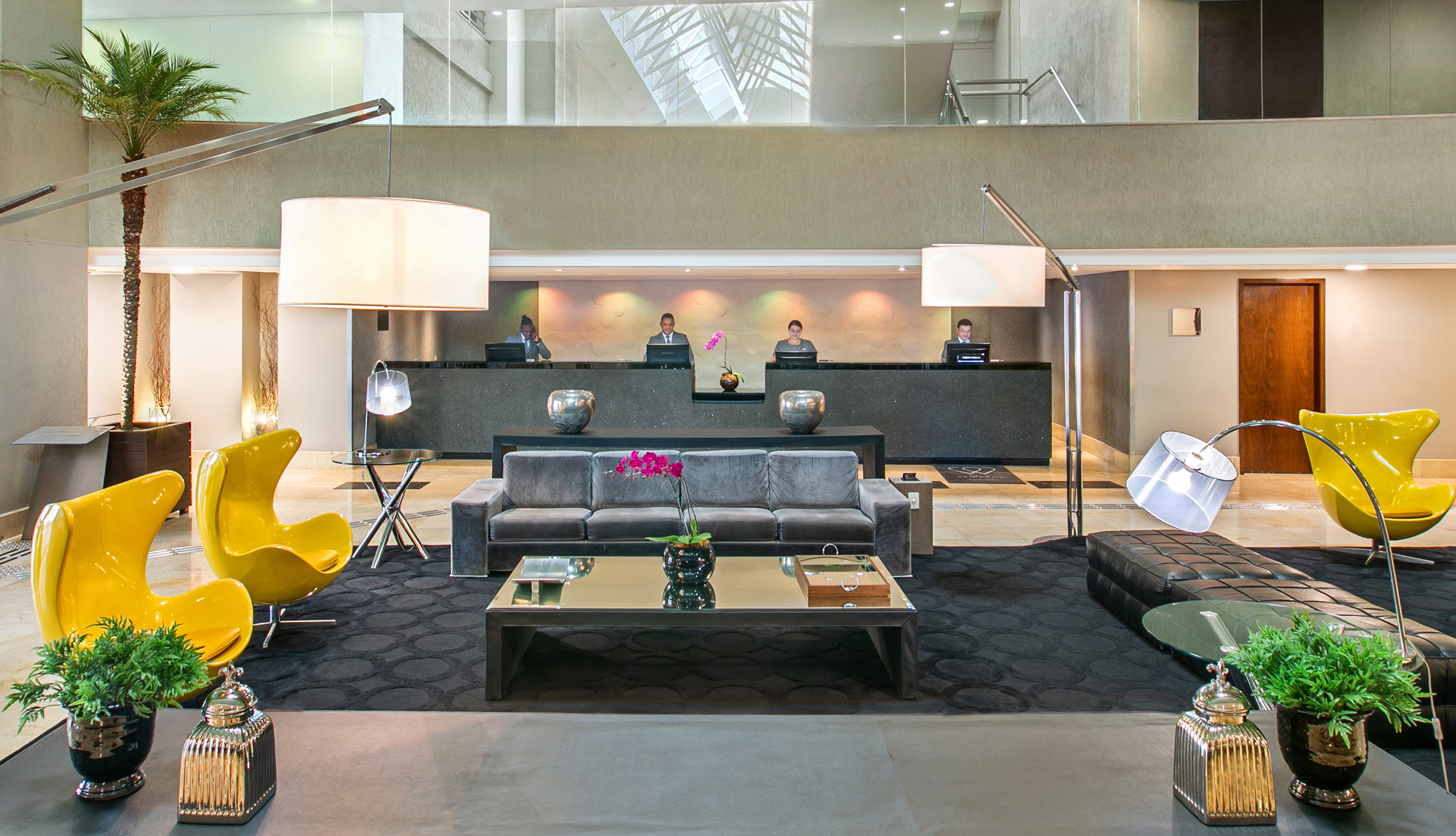 a group of people in a hotel lobby