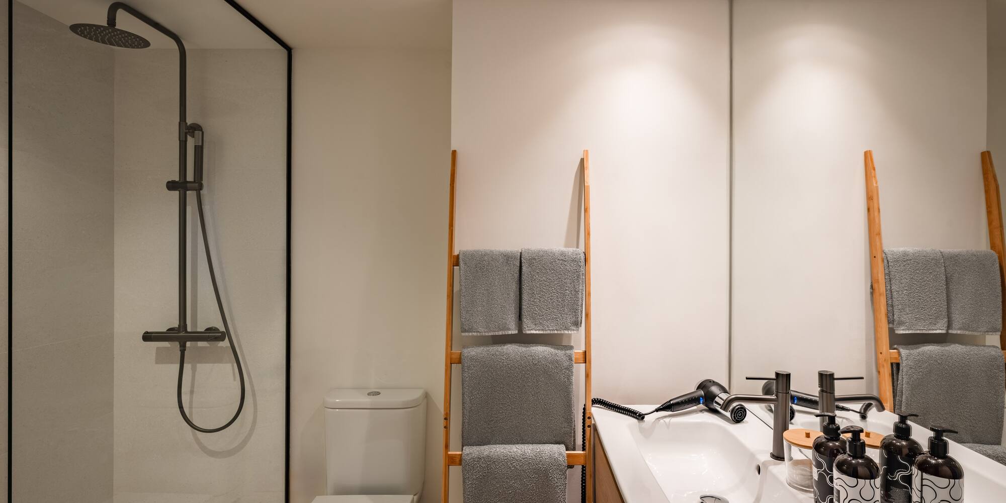 a bathroom with a shower and a sink