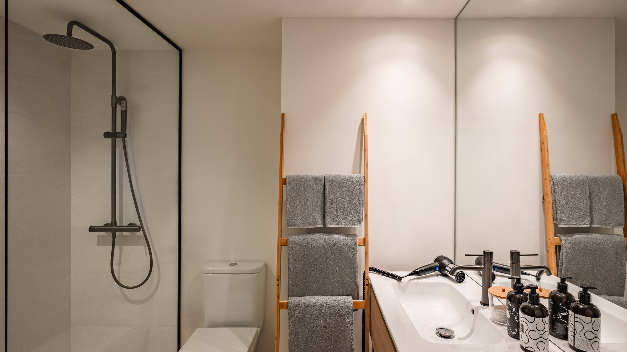 a bathroom with a shower and a sink