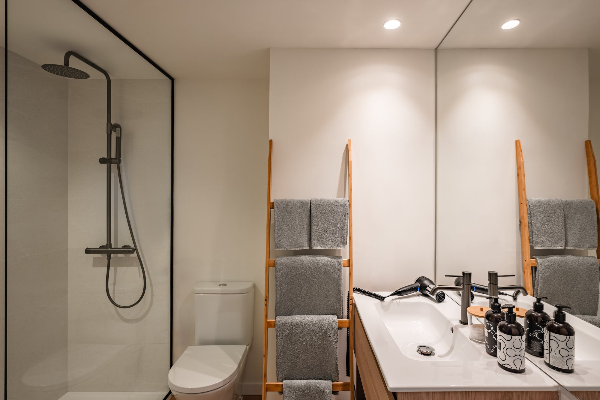 a bathroom with a shower and a sink