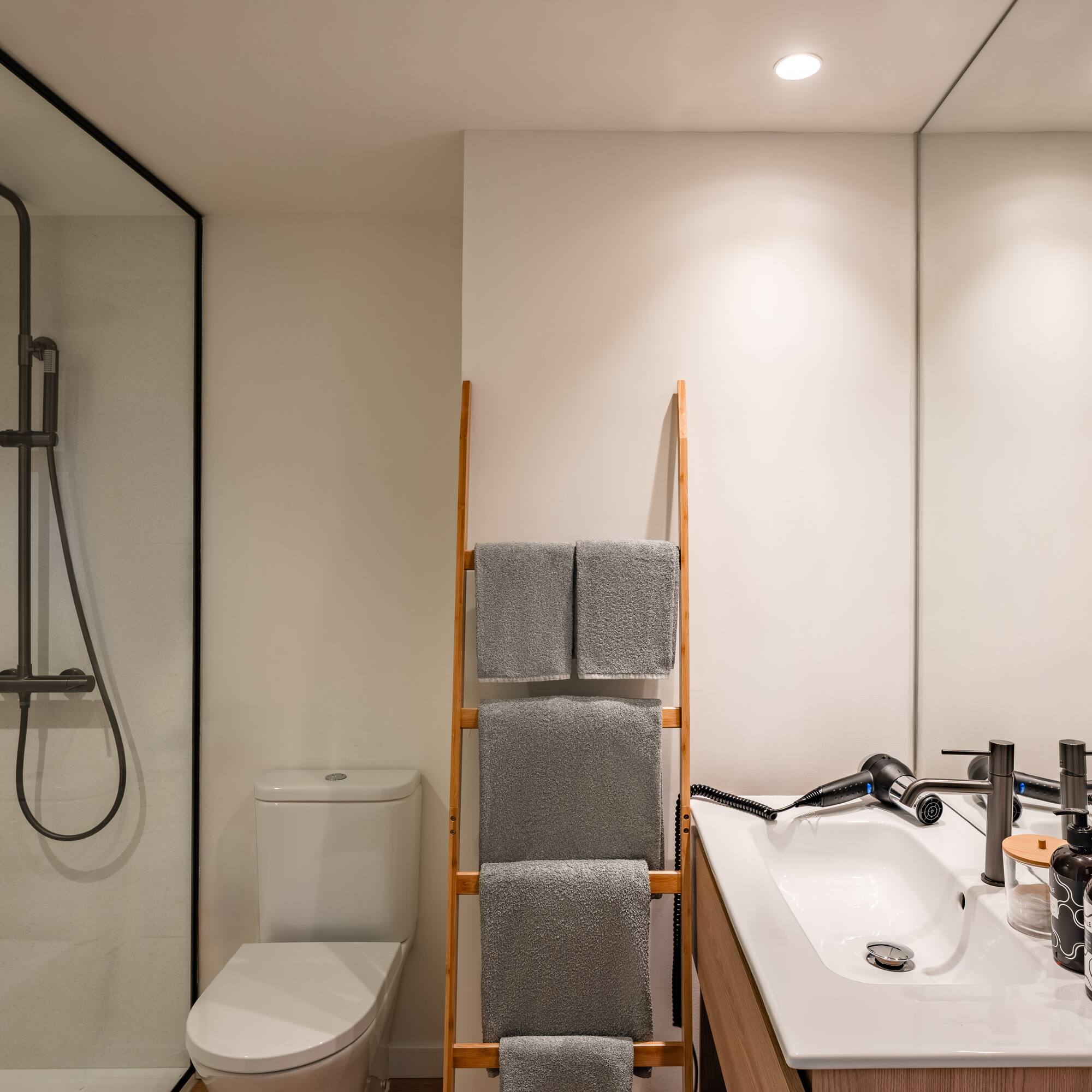 a bathroom with a shower and a sink
