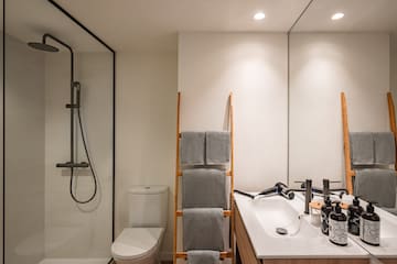 a bathroom with a shower and a sink