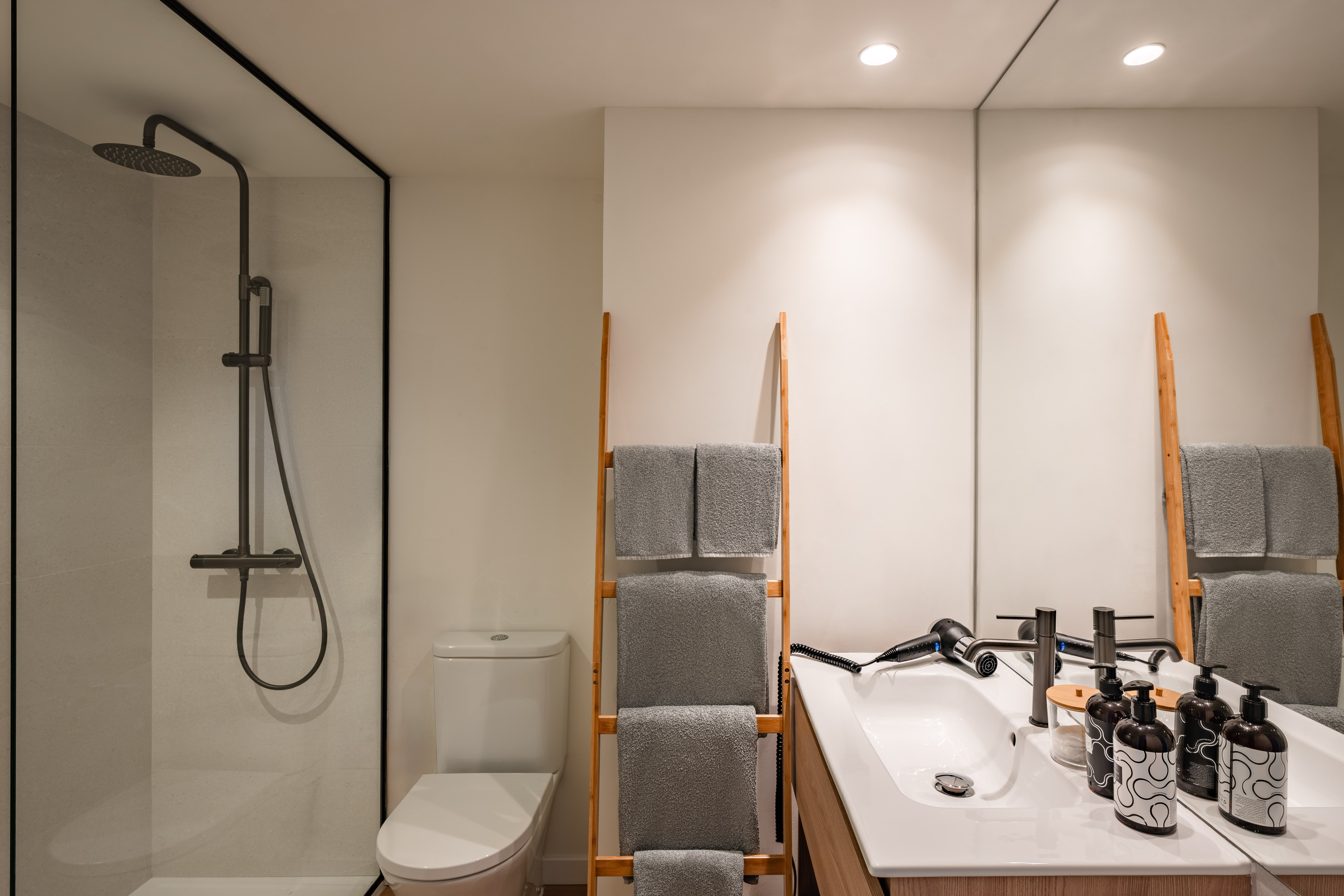 a bathroom with a shower and a sink