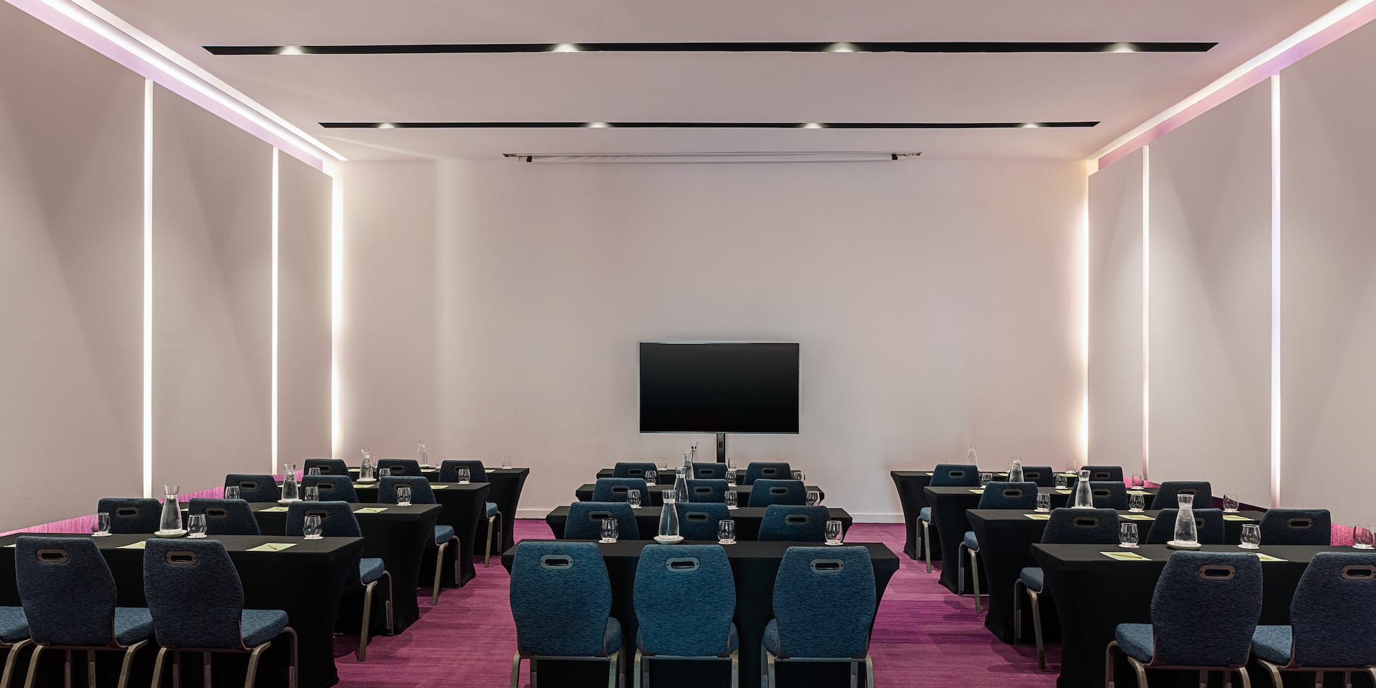 a room with tables and chairs
