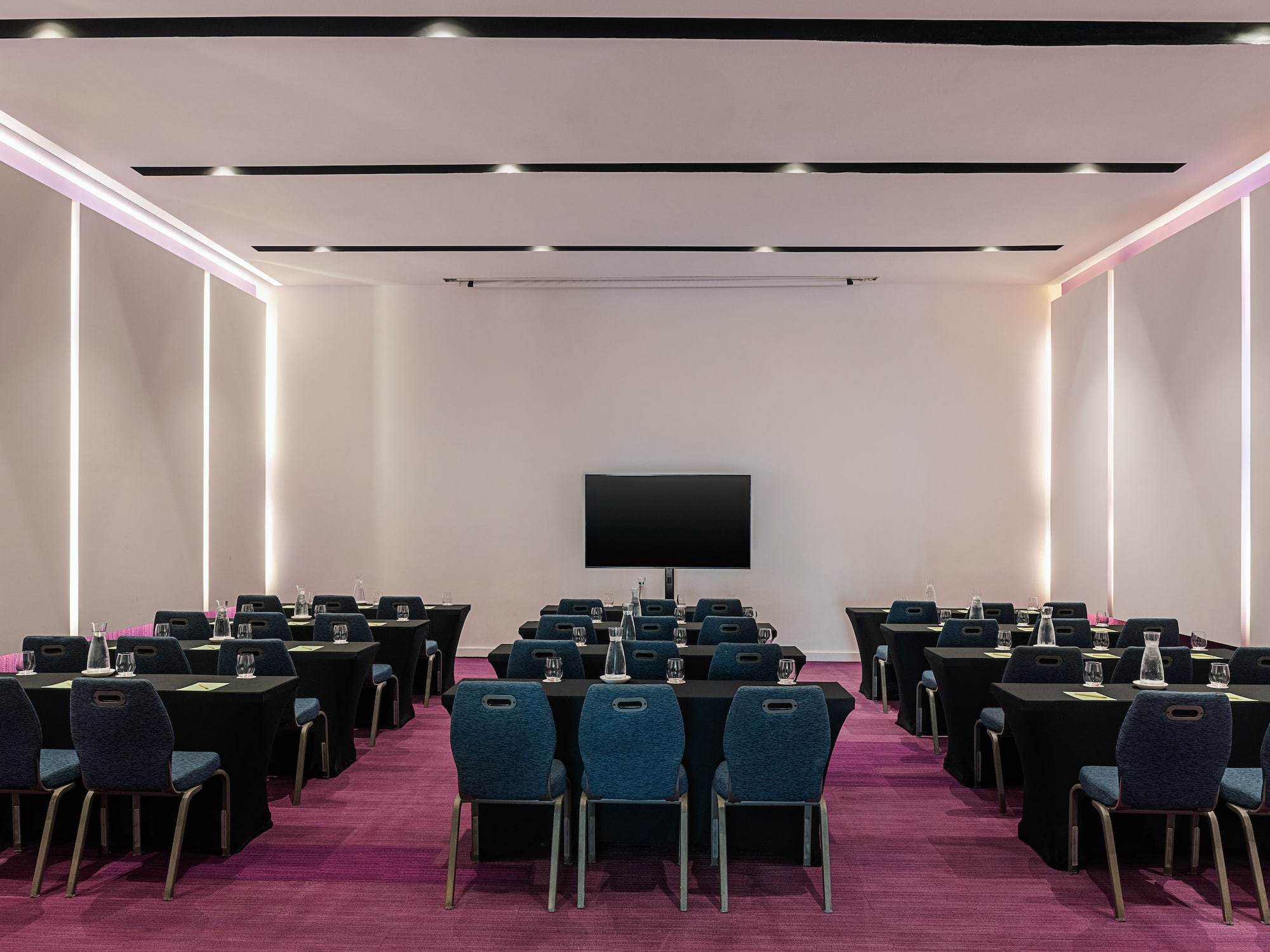 a room with tables and chairs
