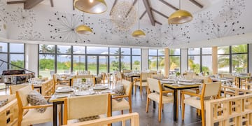 a room with tables and chairs