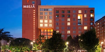 a building with many windows and trees