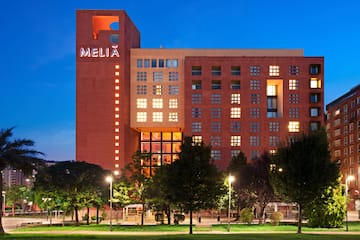 a building with many windows and trees