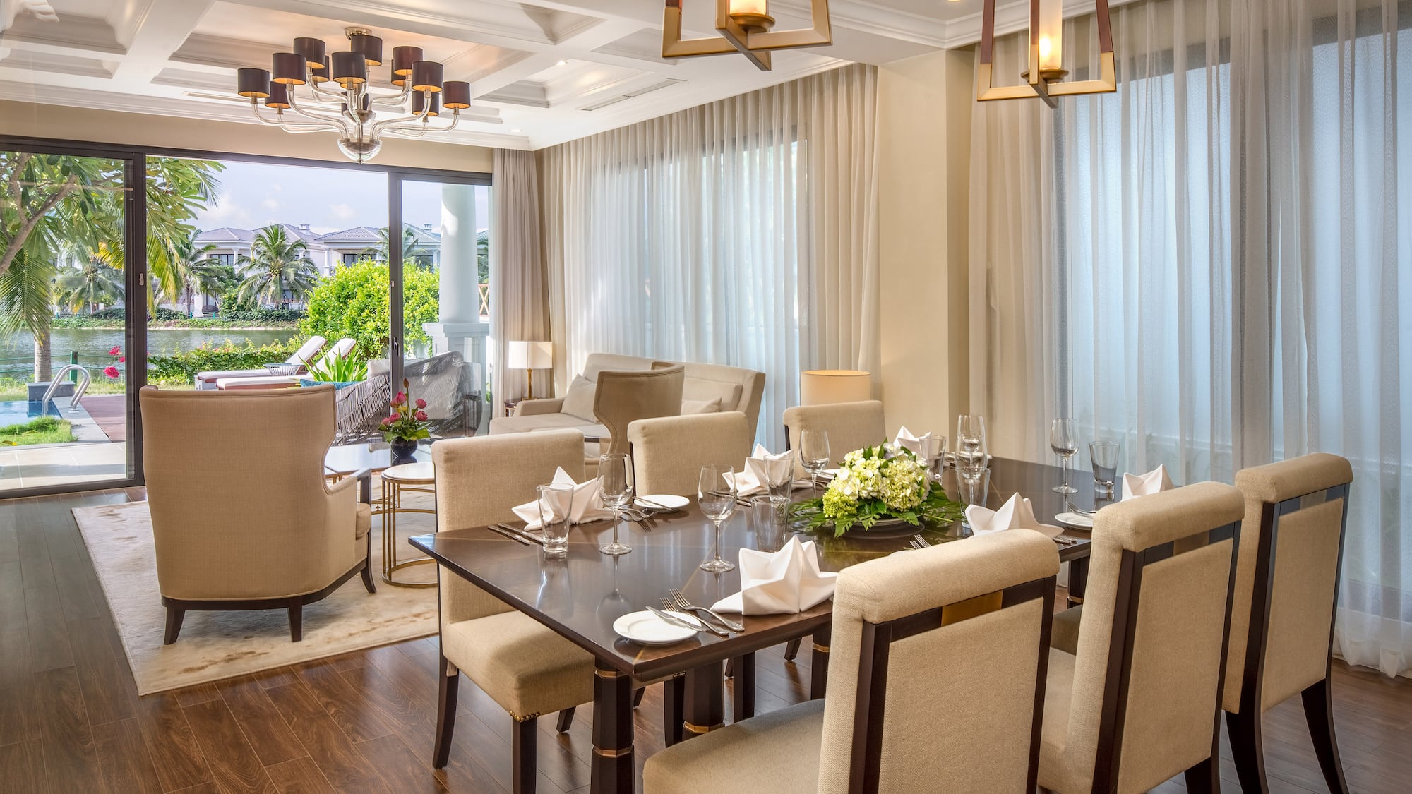 a dining room with a table and chairs