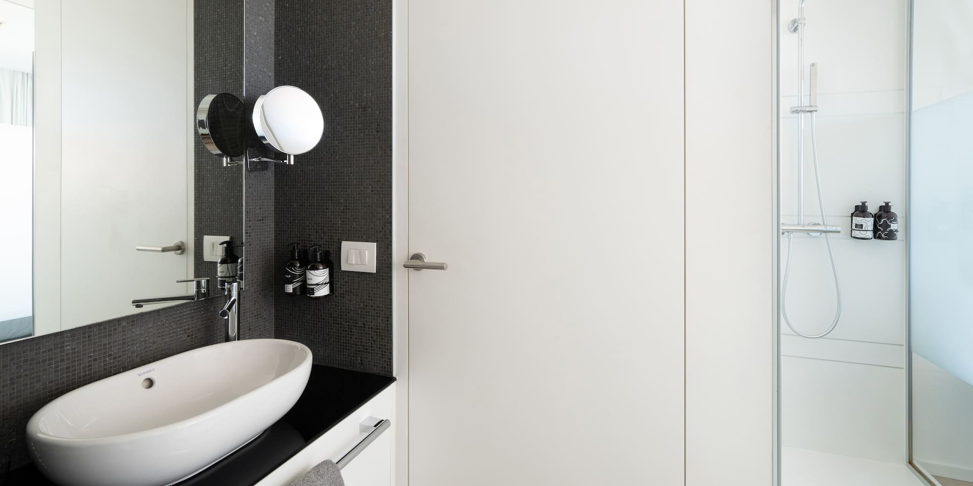 a bathroom with a sink and a shower