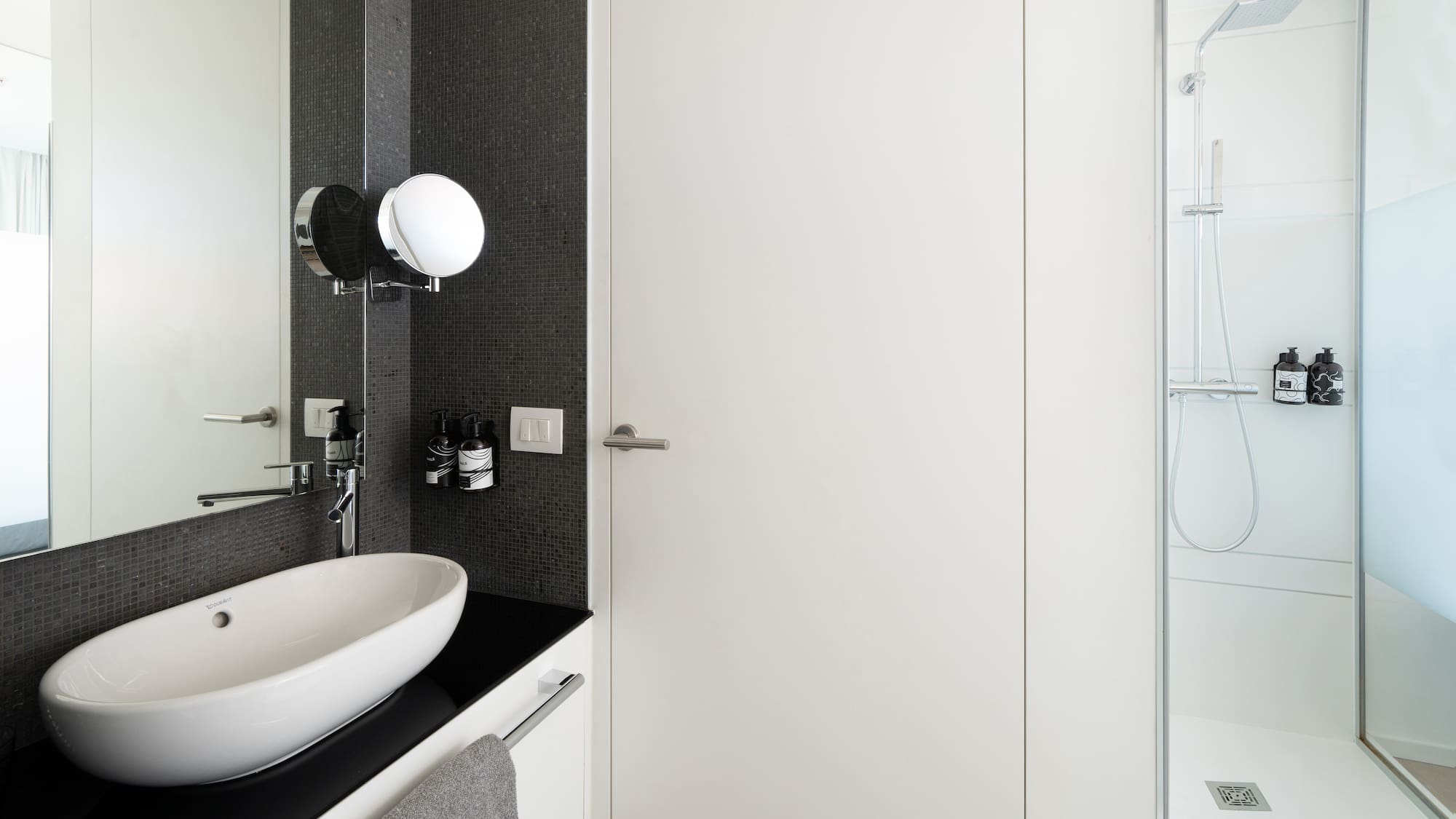 a bathroom with a sink and a shower