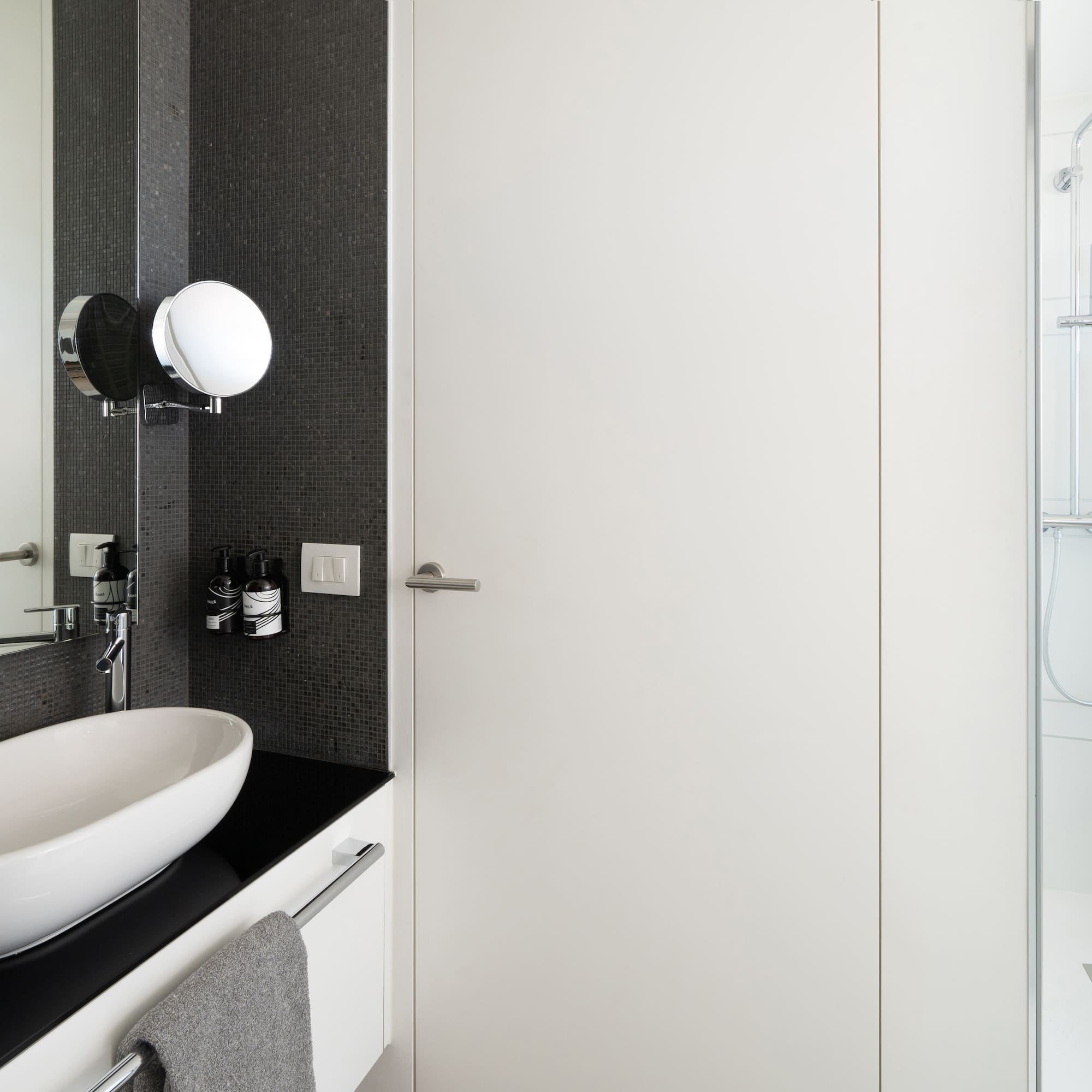 a bathroom with a sink and a shower