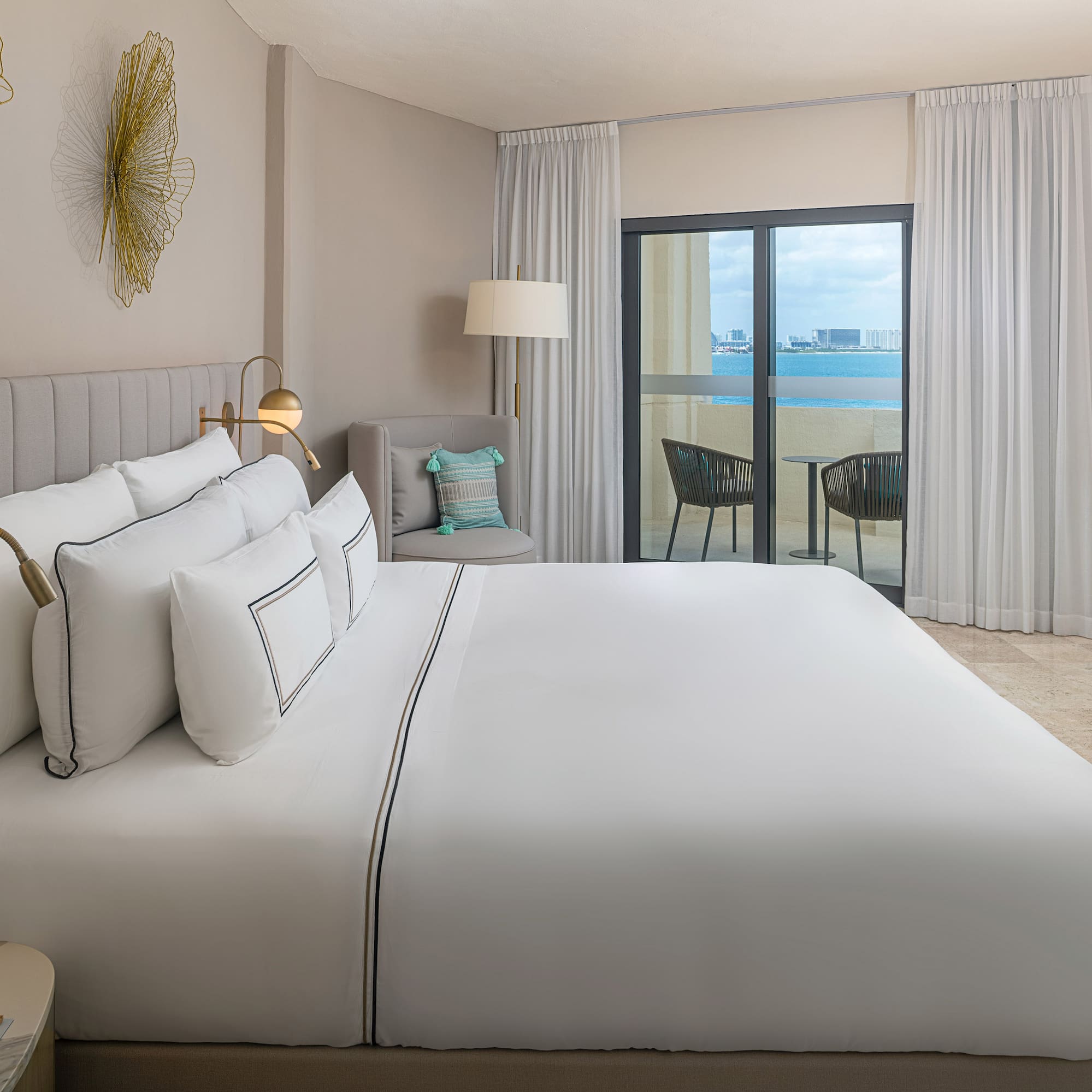 a bed in a room with a glass door