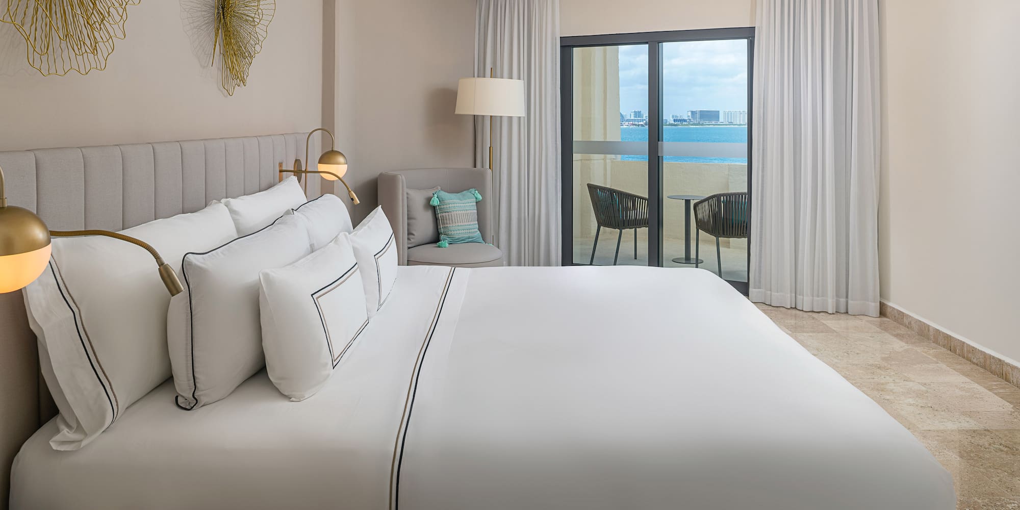 a bed in a room with a glass door