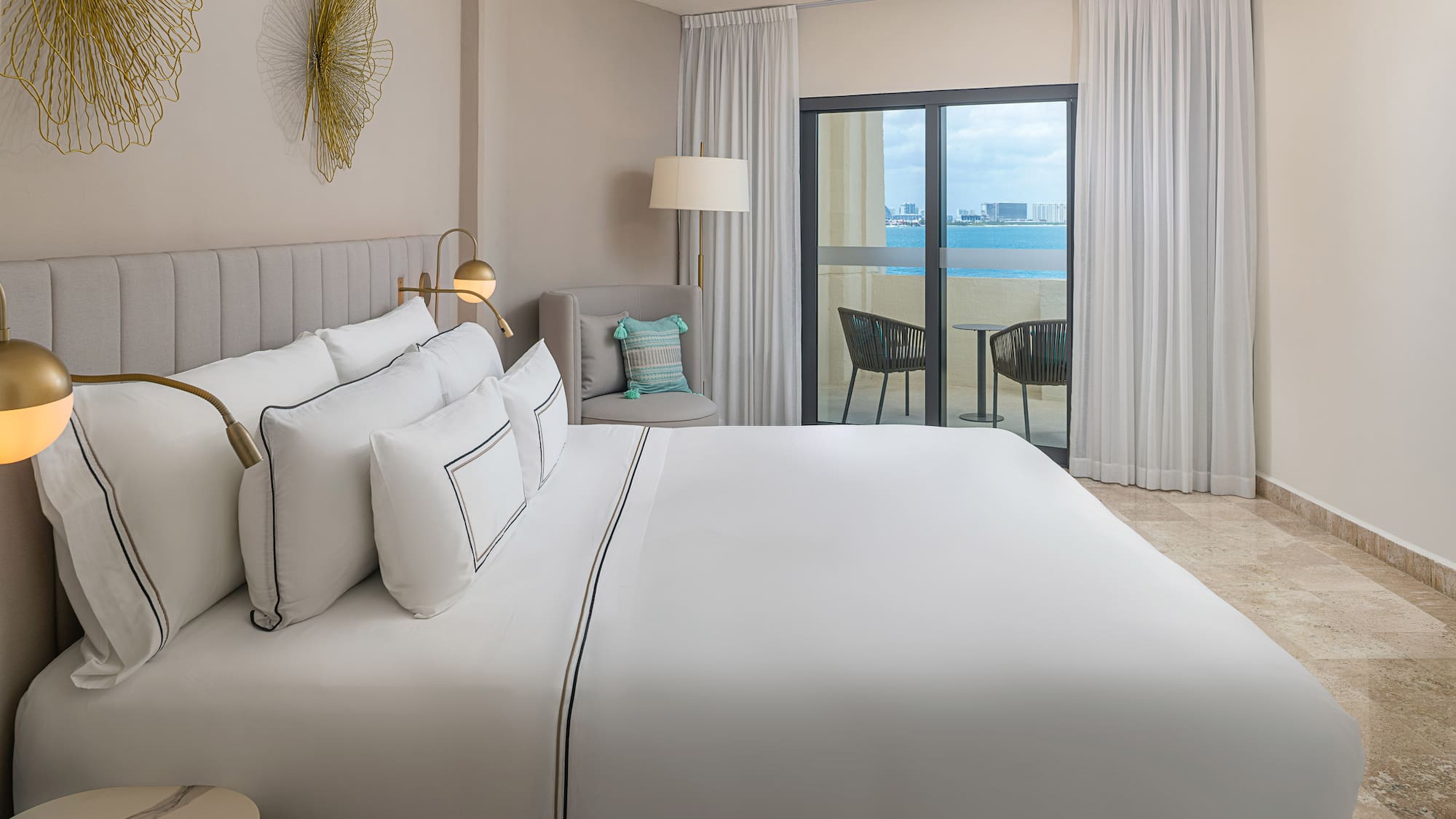 a bed in a room with a glass door