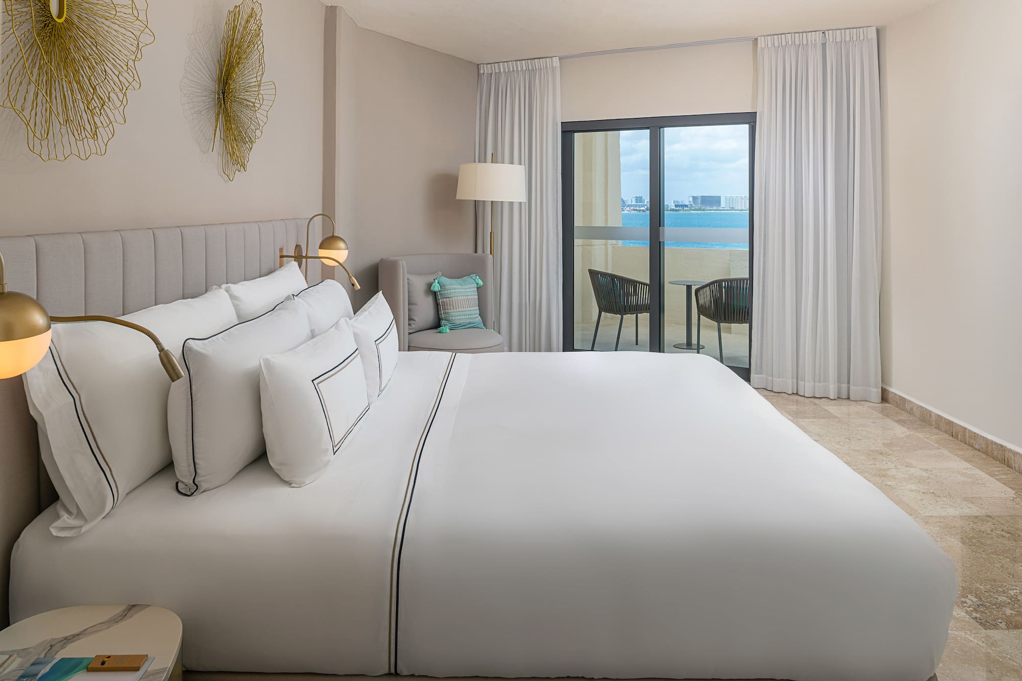 a bed in a room with a glass door