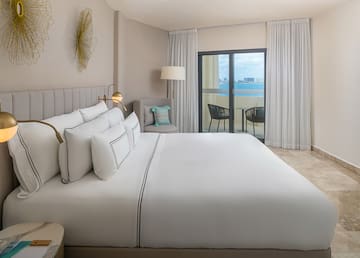 a bed in a room with a glass door