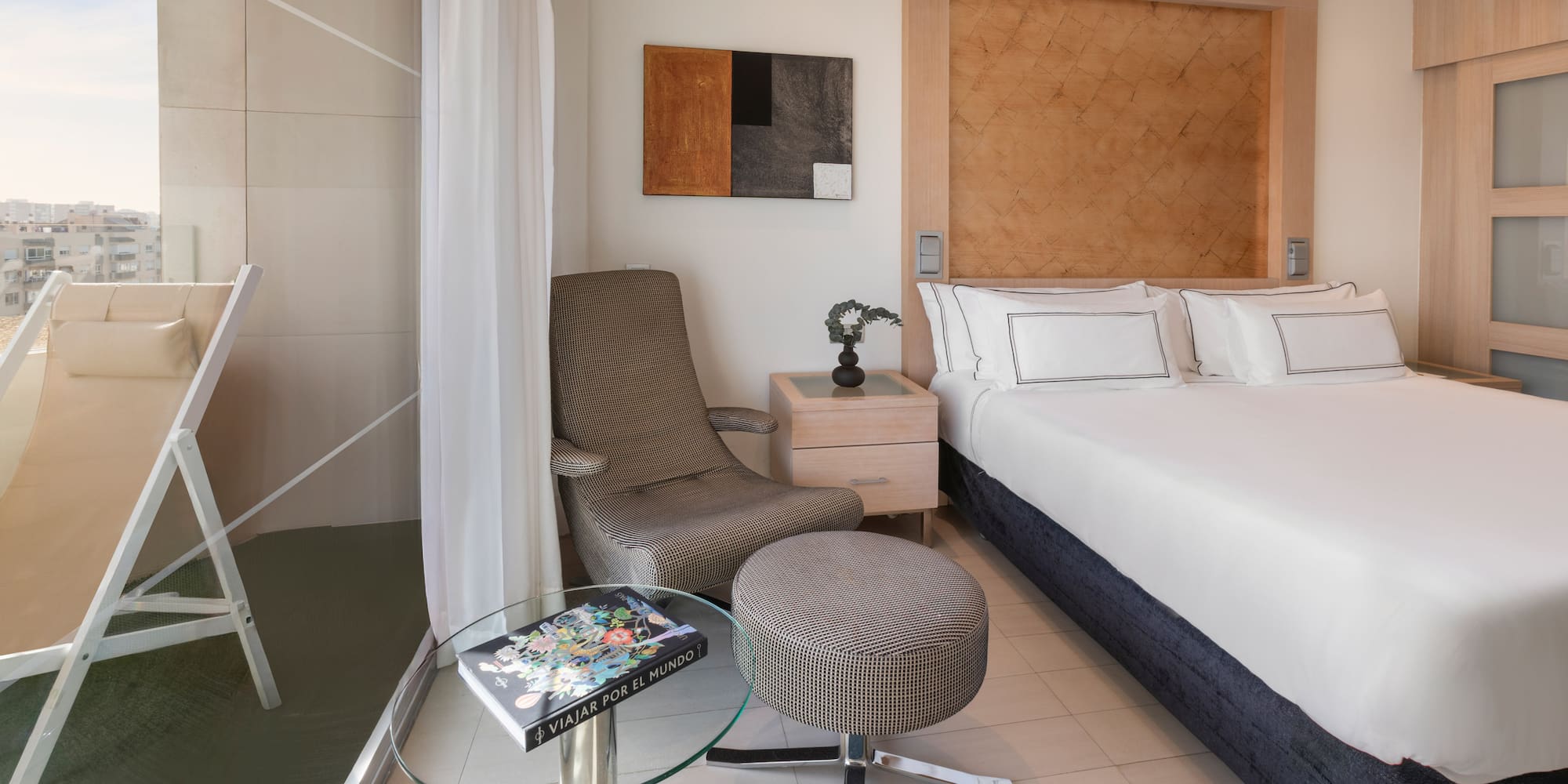 a room with a bed and a chair