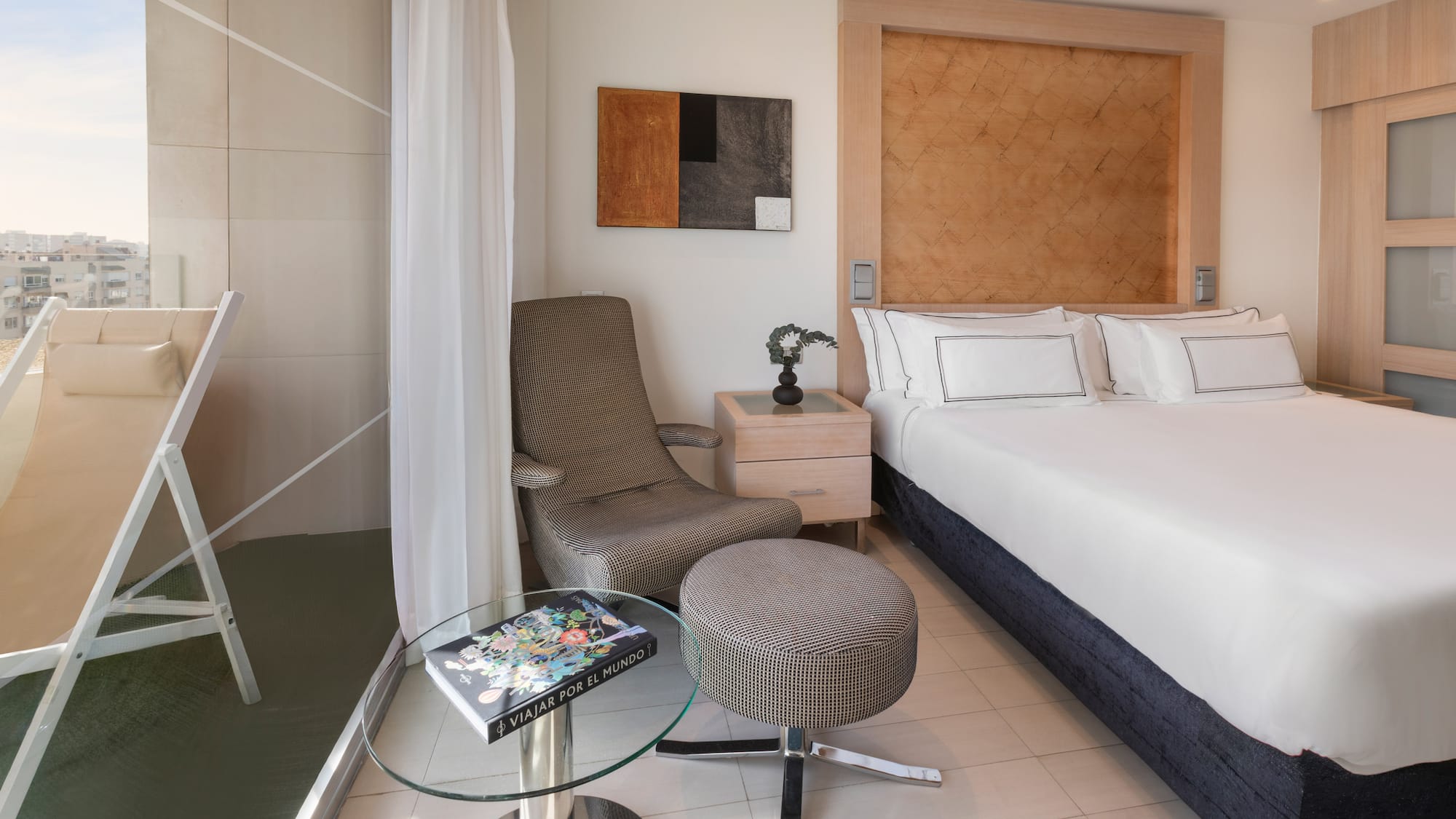 a room with a bed and a chair