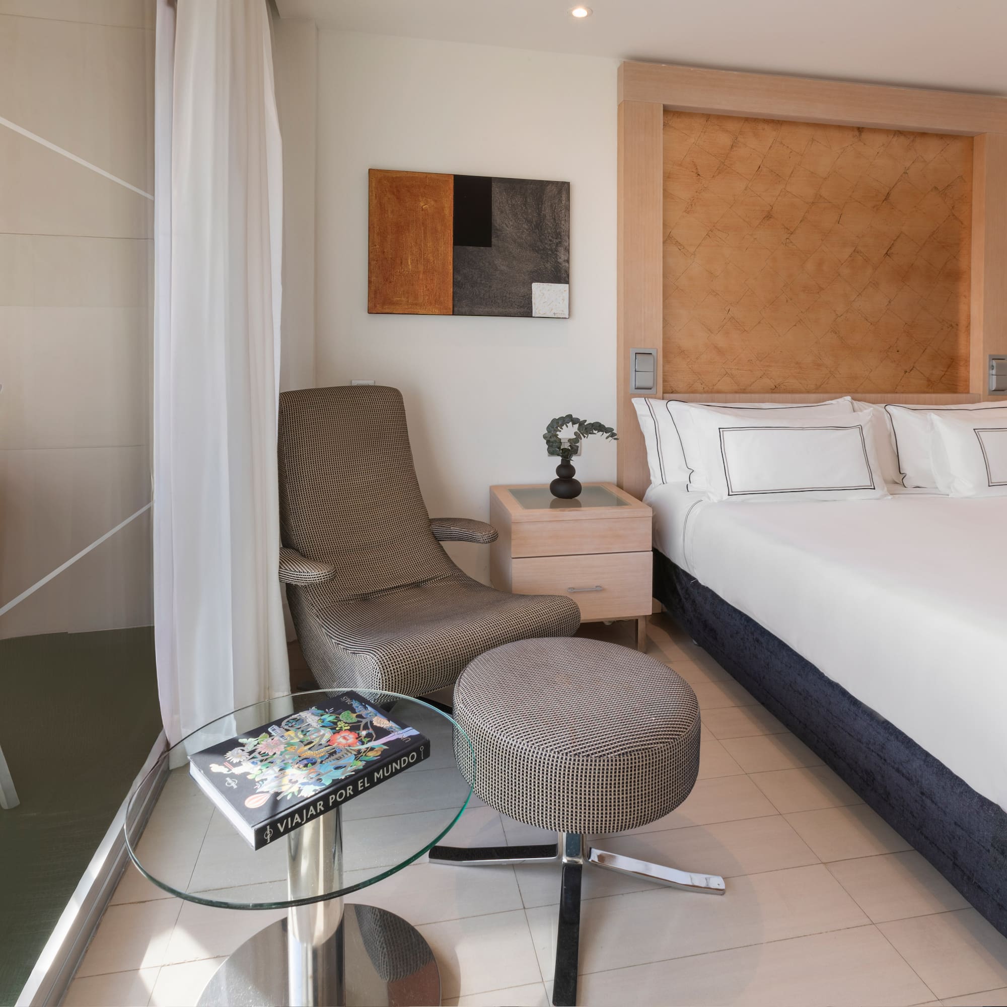 a room with a bed and a chair