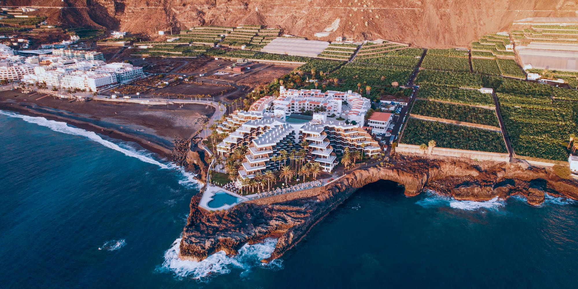 a large building on a rocky island