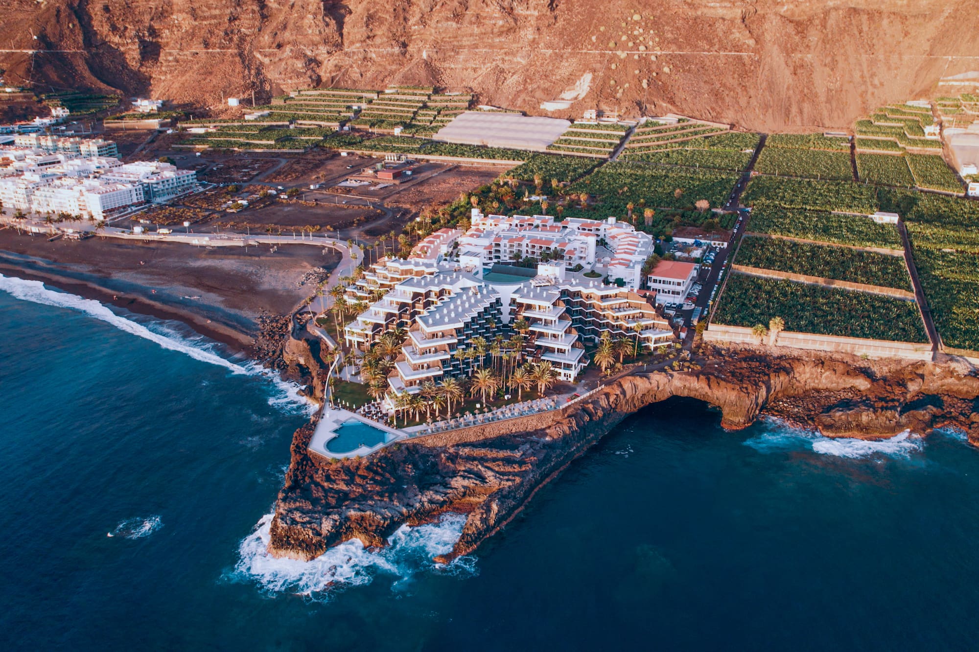 a large building on a rocky island