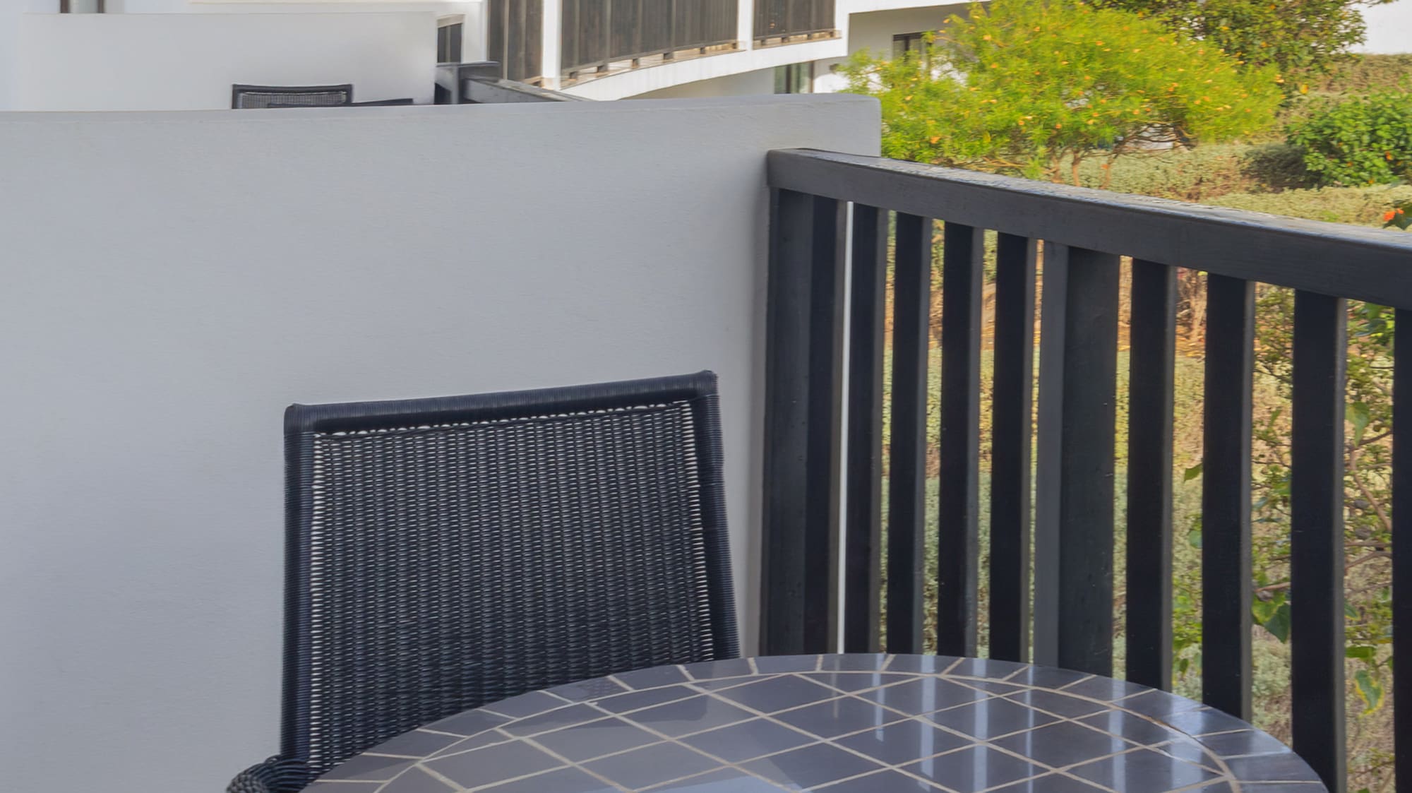 a table and chairs on a balcony