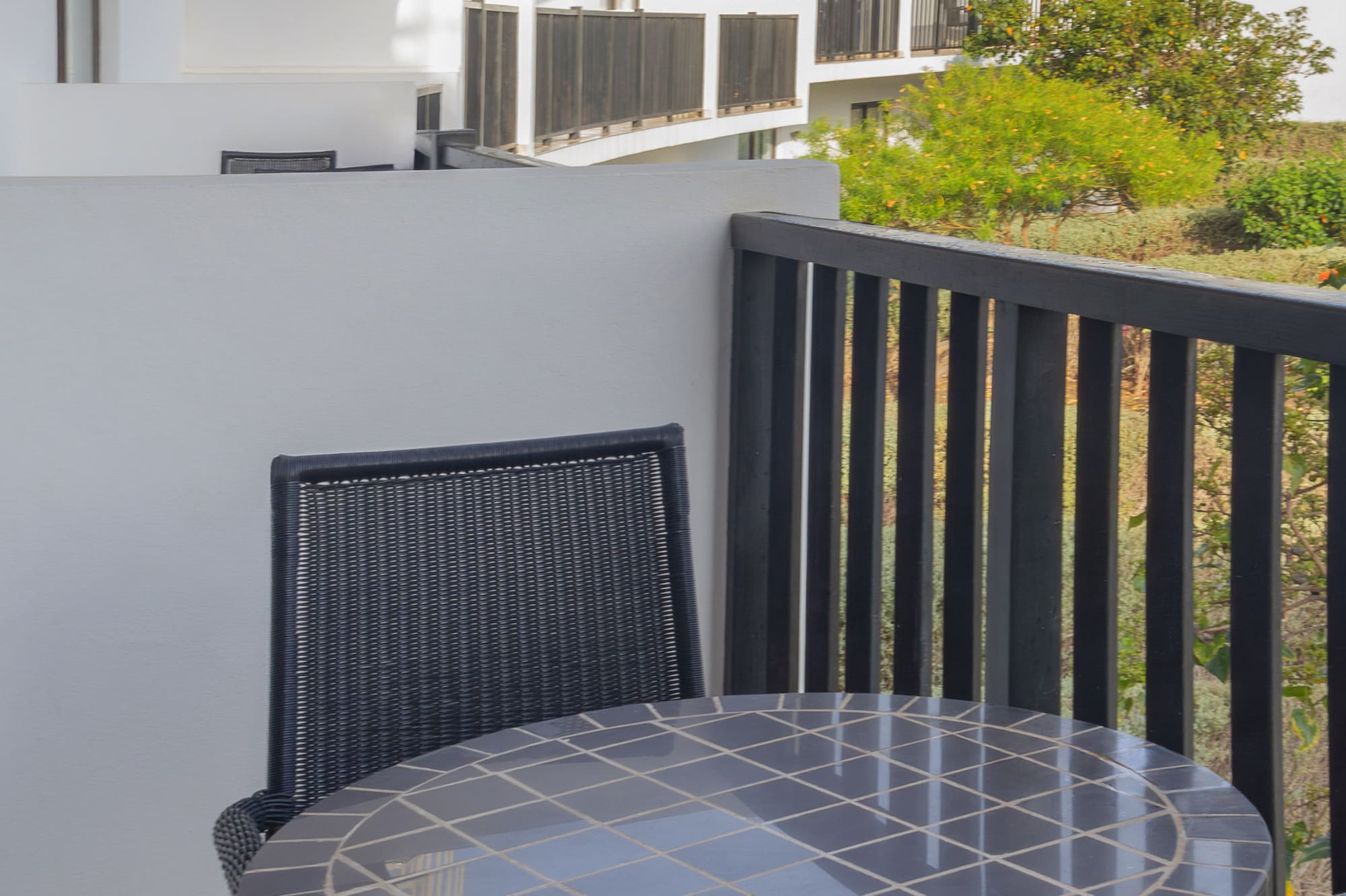 a table and chairs on a balcony