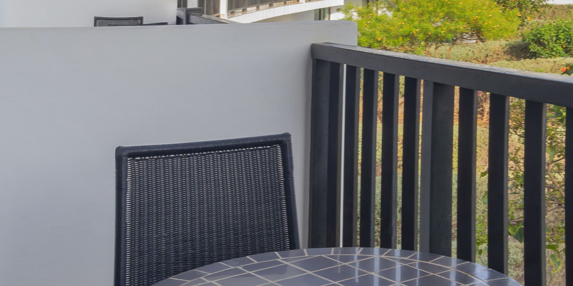 a table and chairs on a balcony