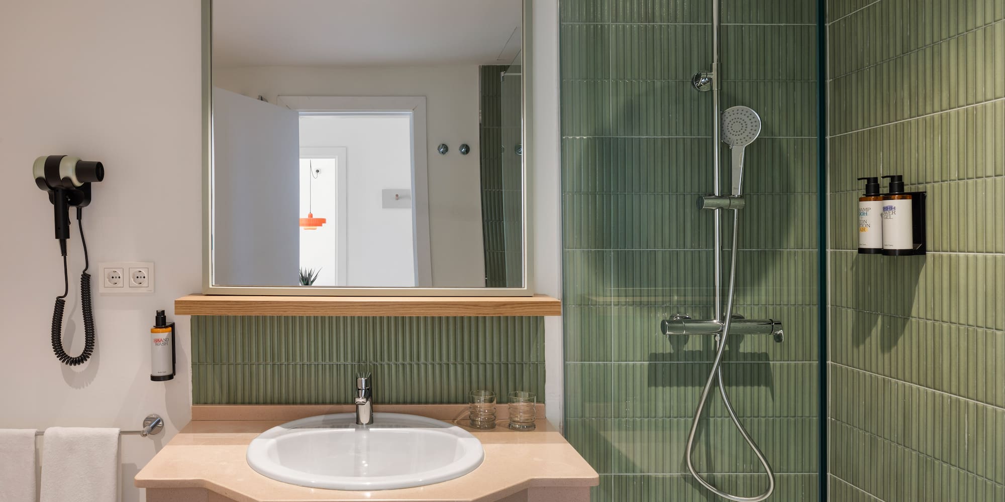 a bathroom with a sink and shower