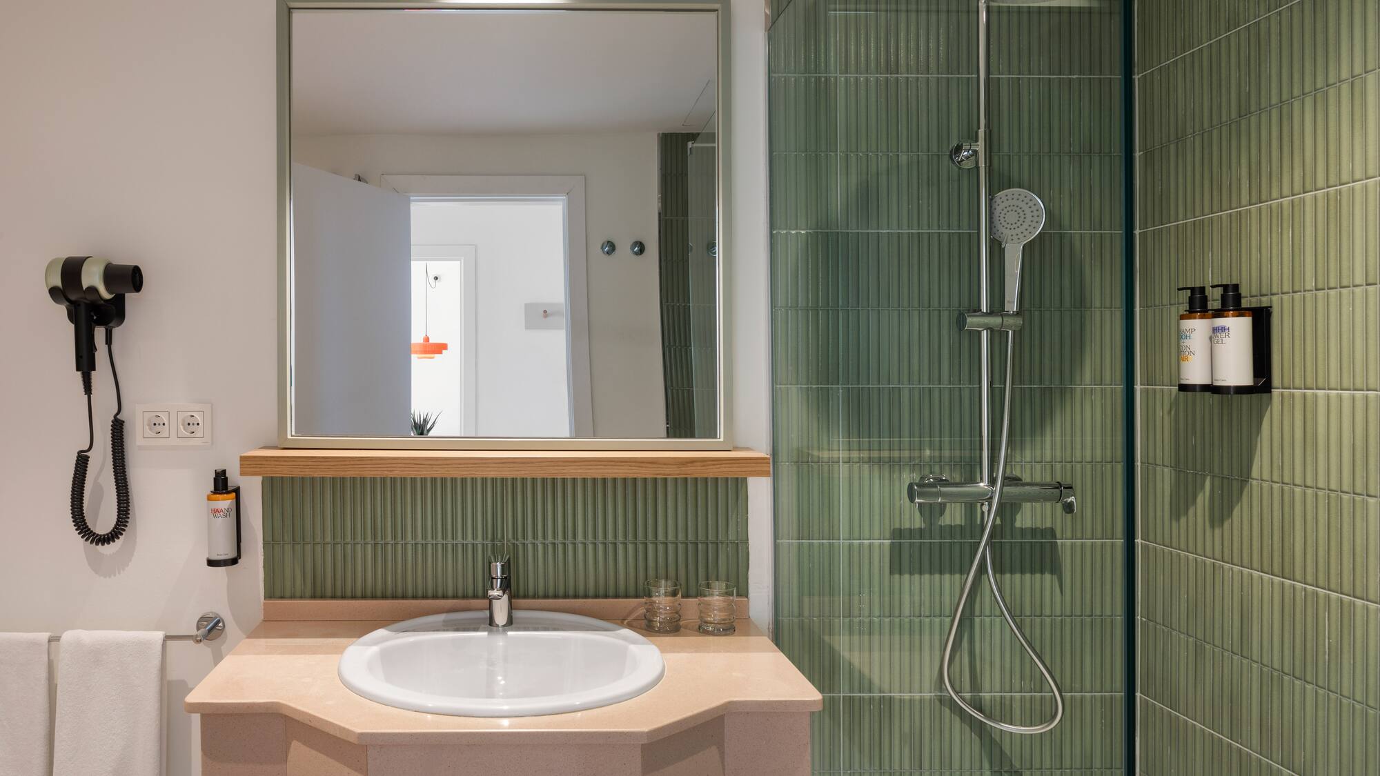 a bathroom with a sink and shower