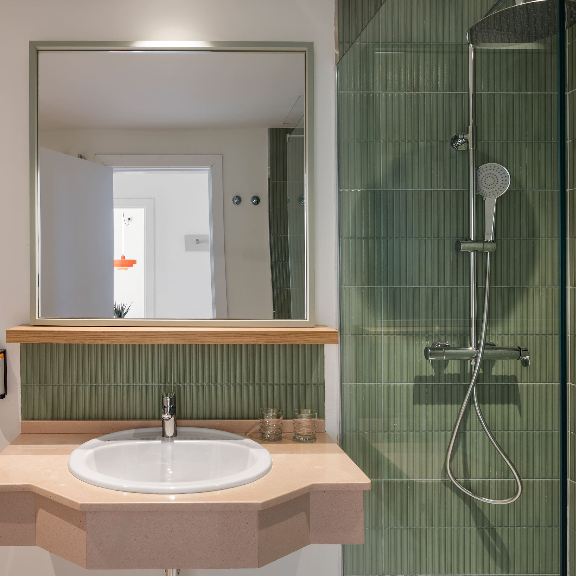 a bathroom with a sink and shower