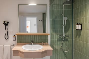 a bathroom with a mirror and a sink