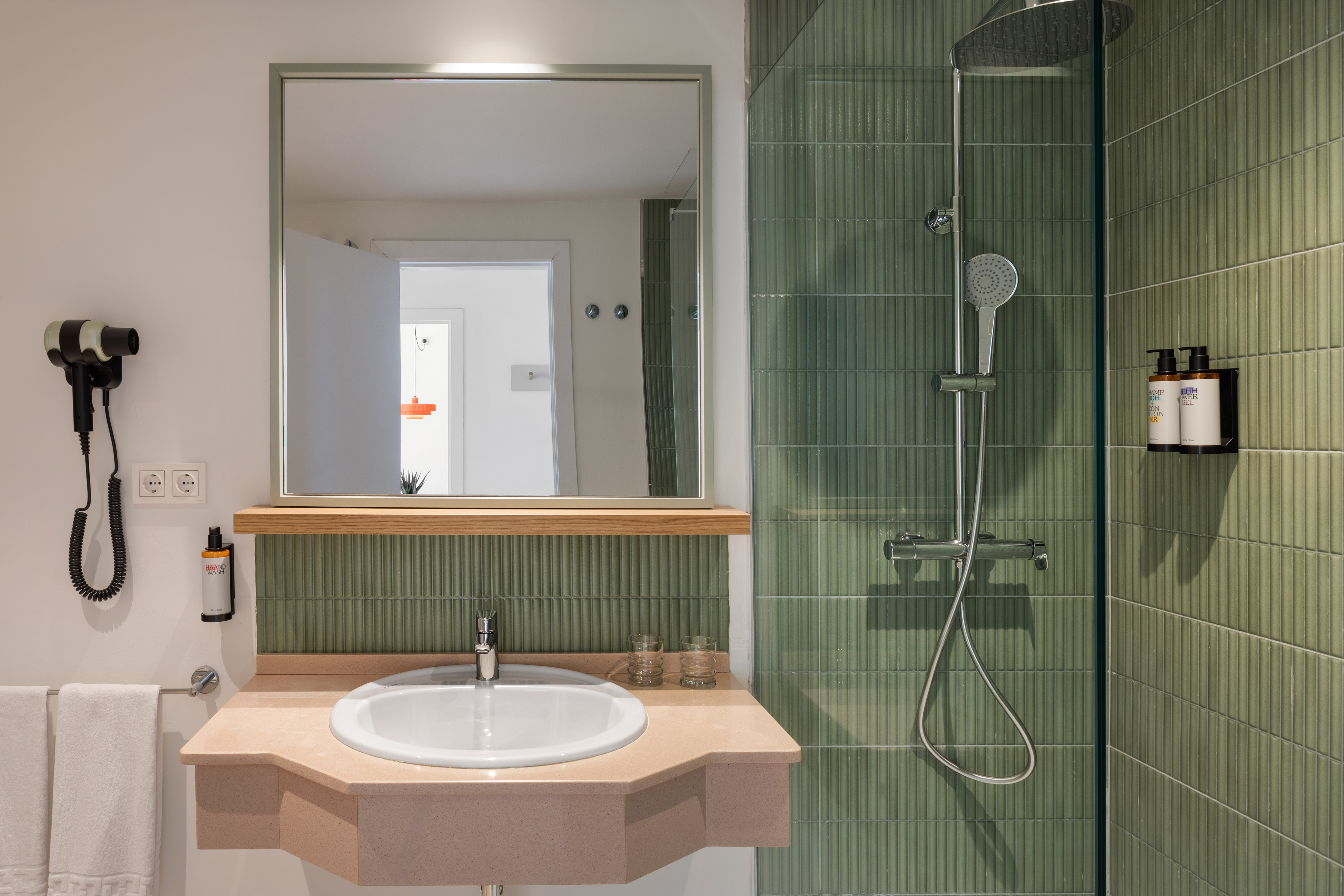 a bathroom with a sink and shower