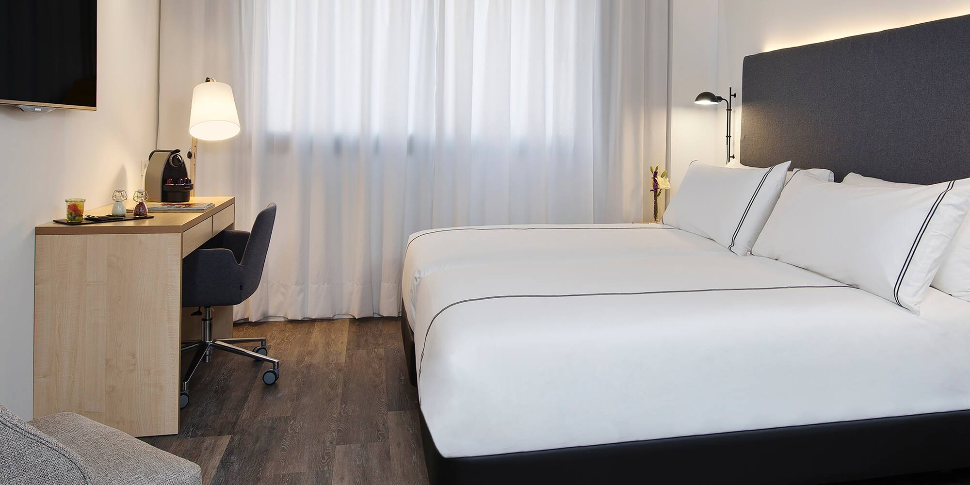 a room with a bed and a desk