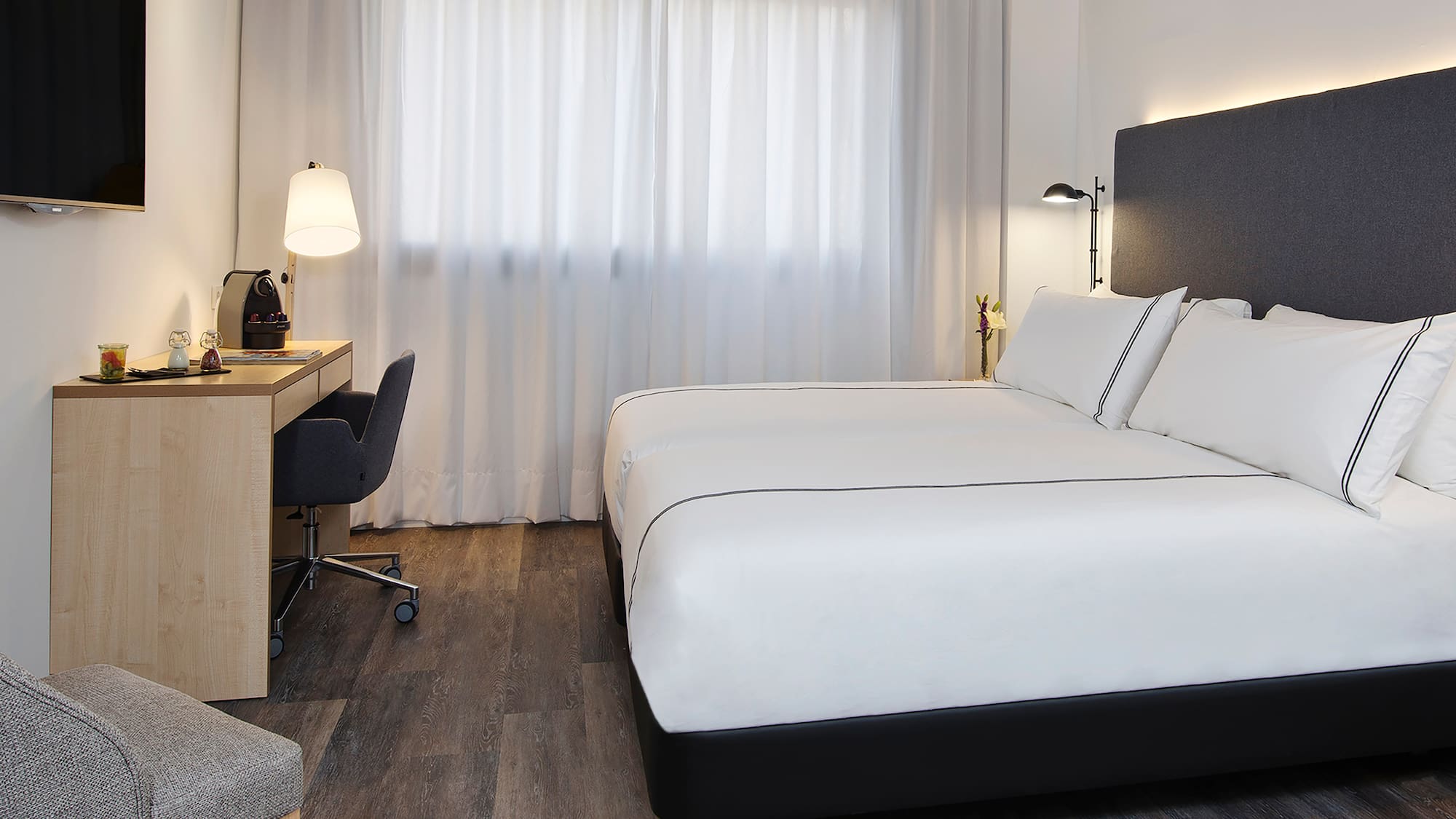 a room with a bed and a desk