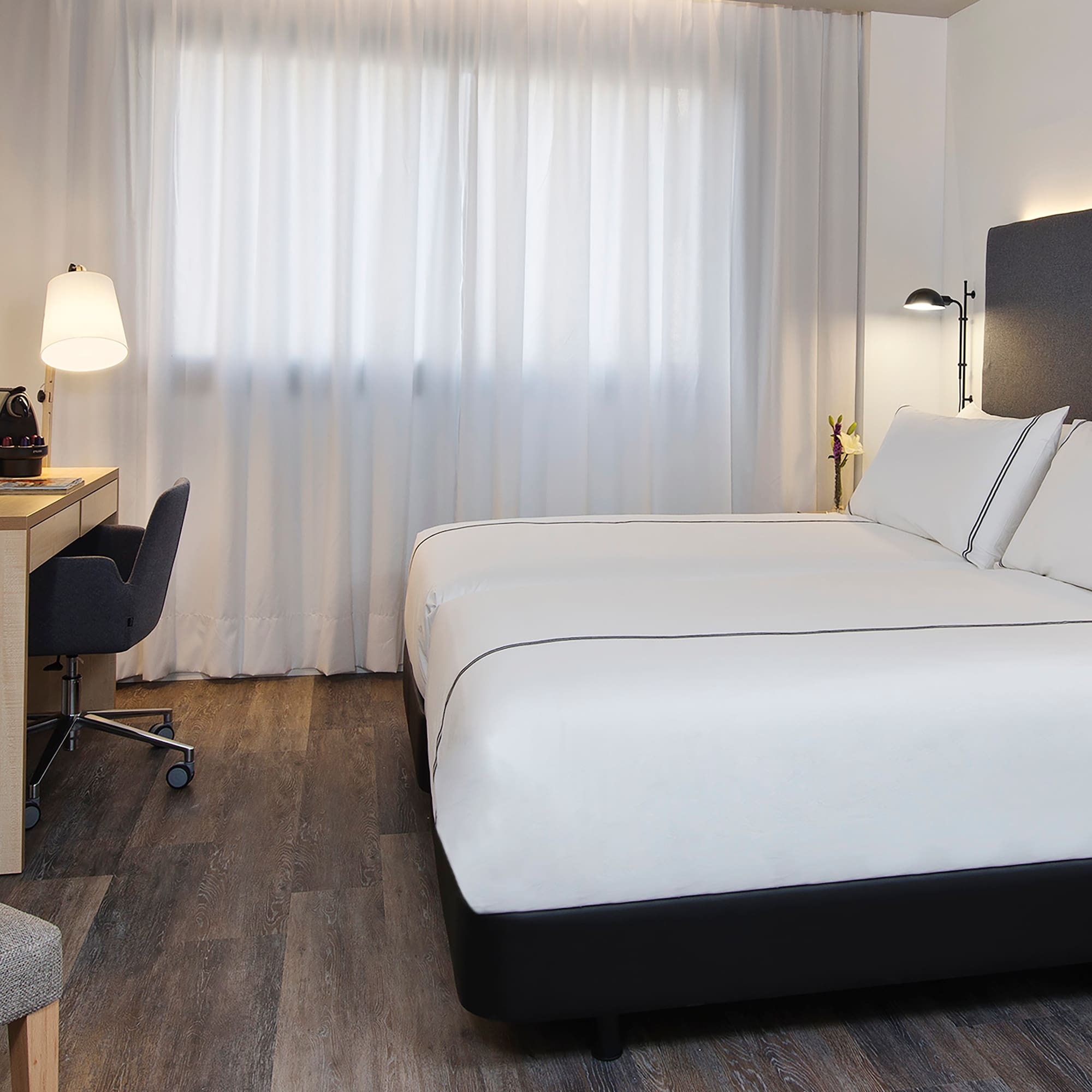 a room with a bed and a desk