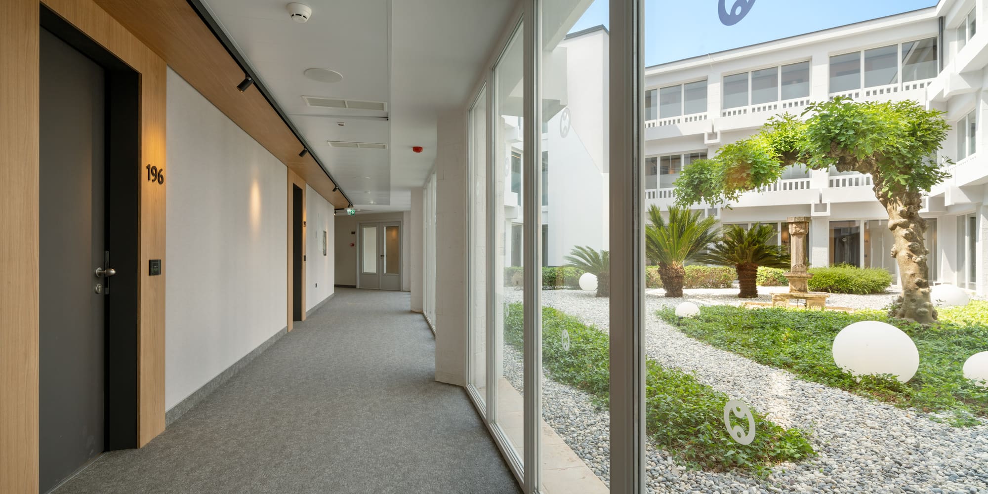 a hallway with large windows
