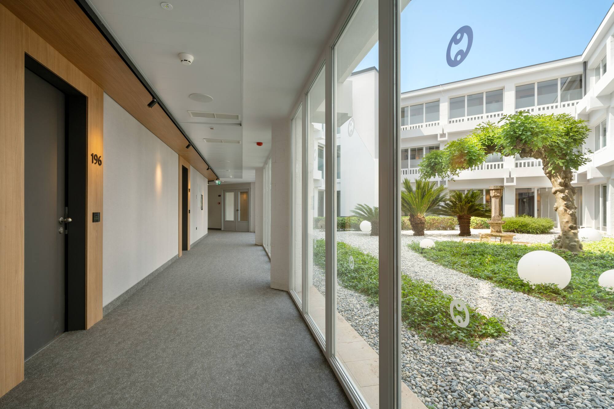 a hallway with large windows