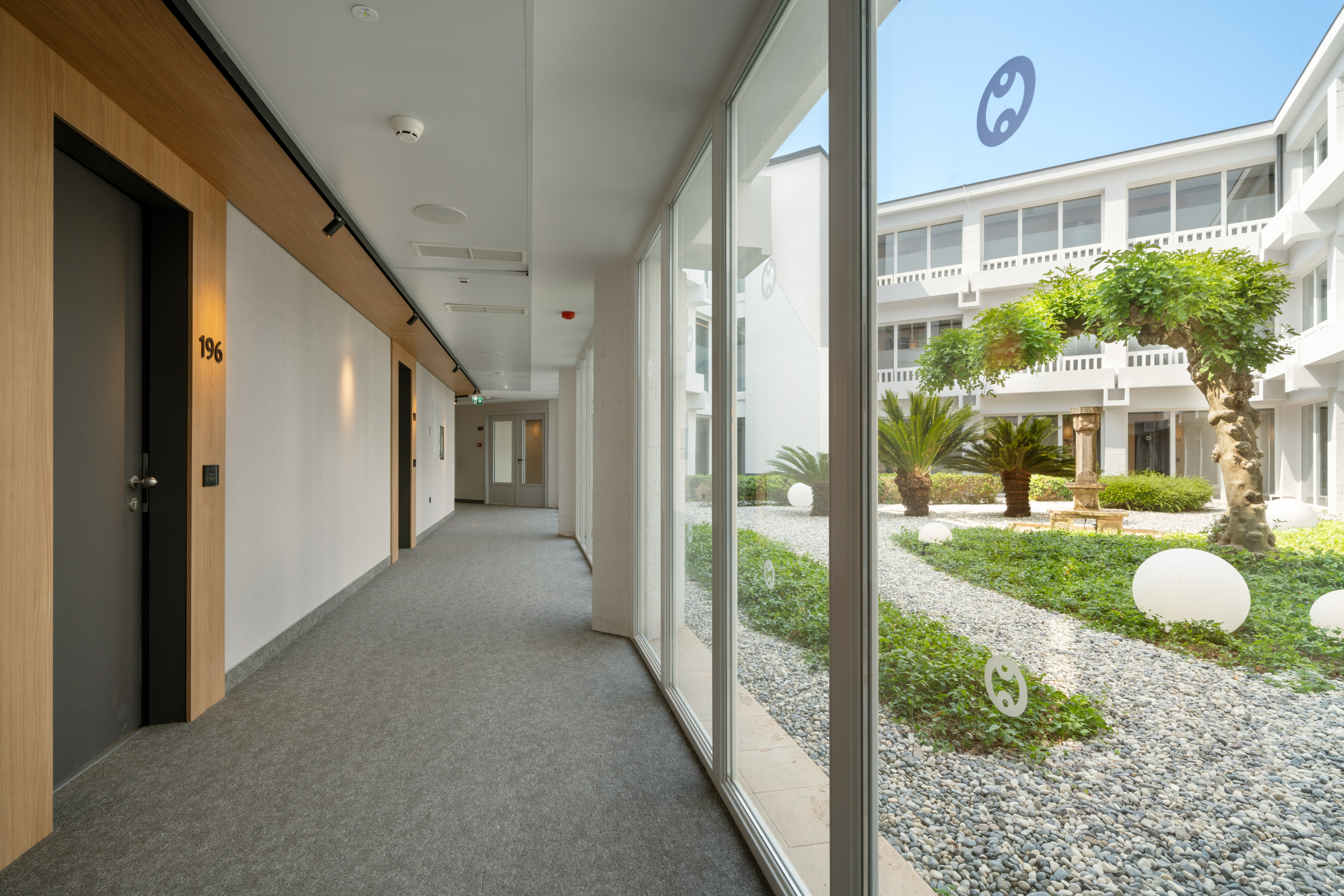 a hallway with large windows