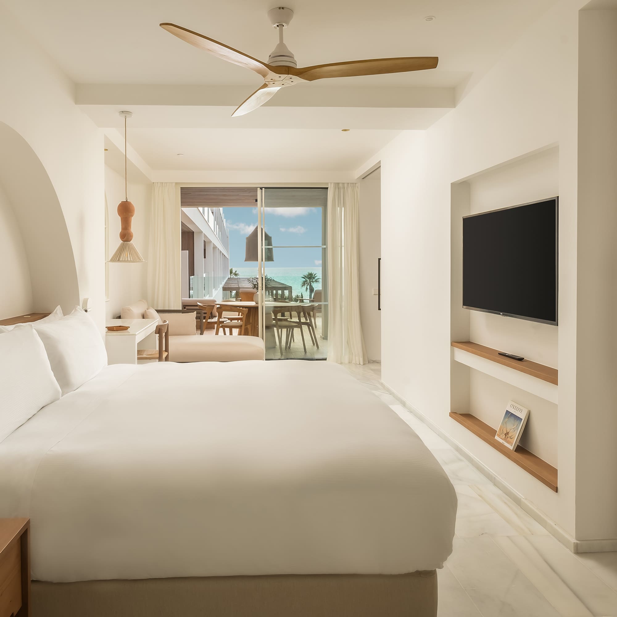 a room with a bed and a television