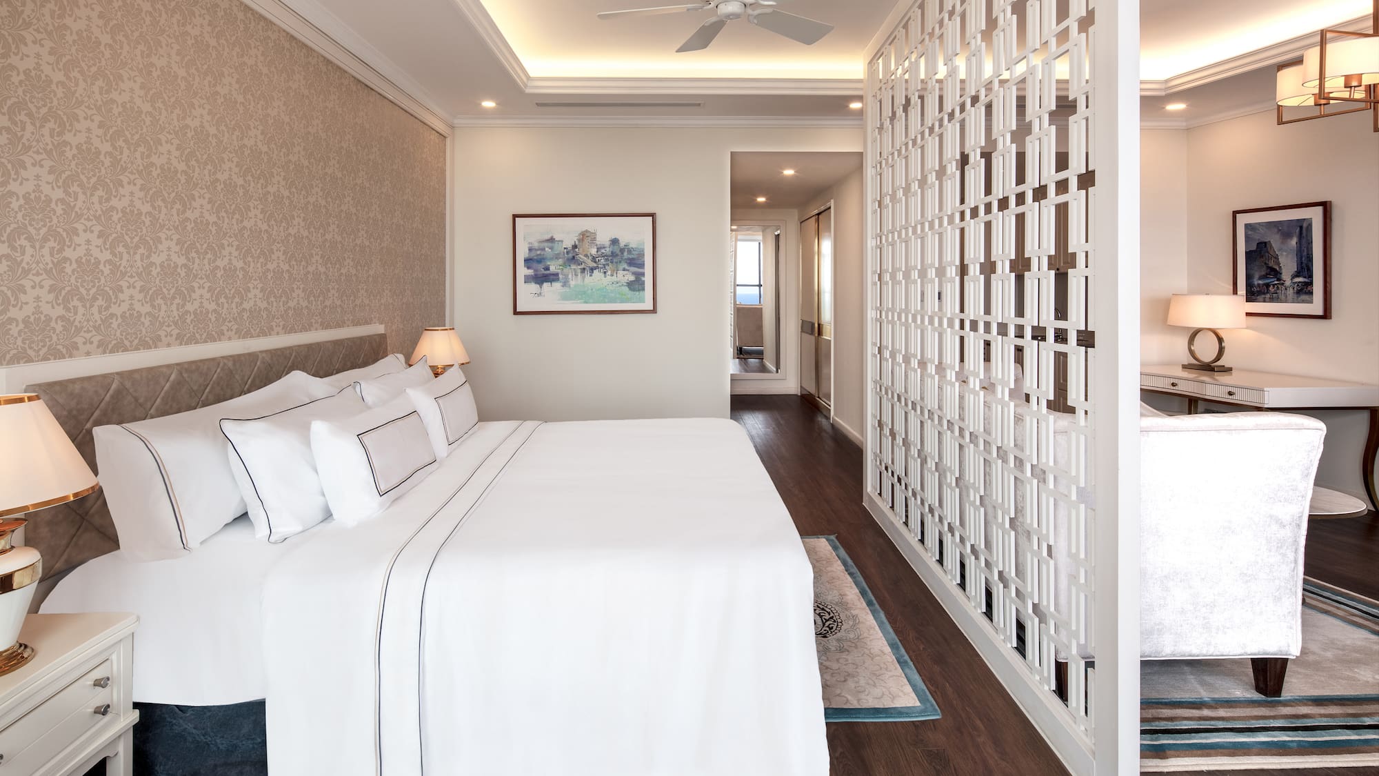 a room with a bed and a ceiling fan