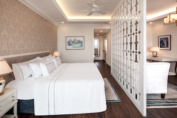 a room with a bed and a ceiling fan