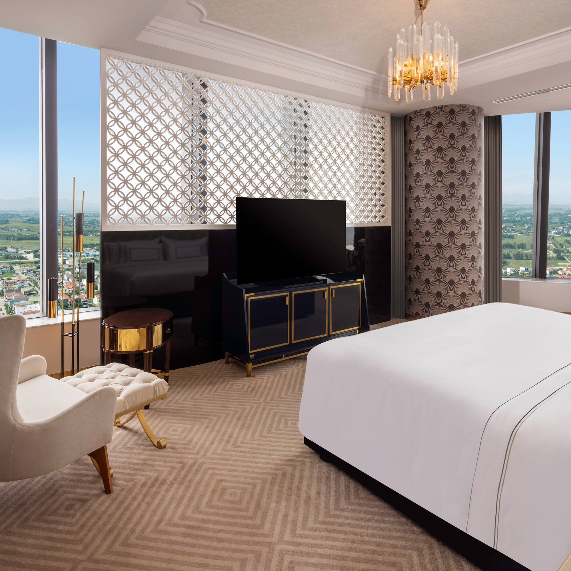 a room with a bed and a television