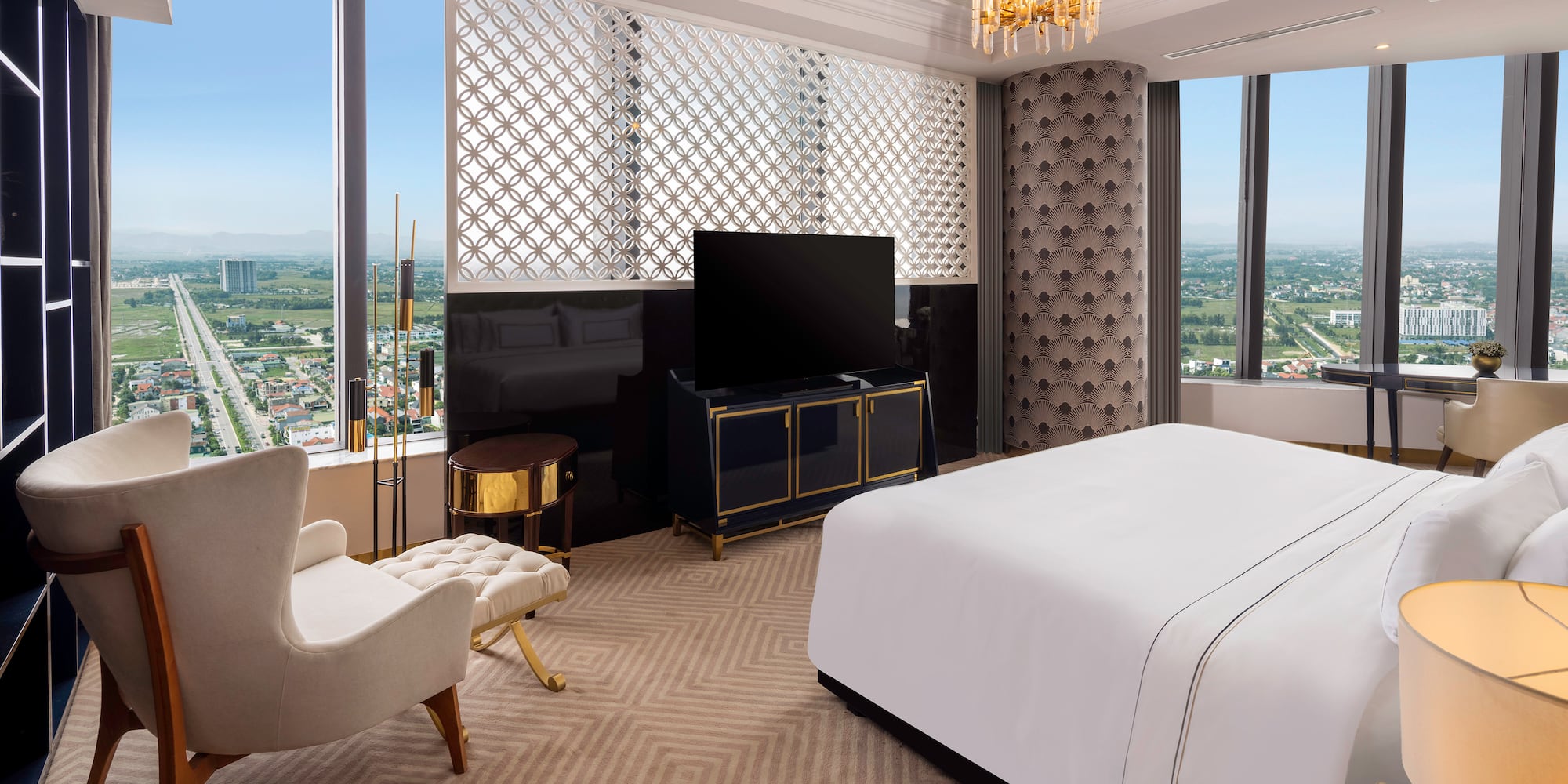 a room with a bed and a television