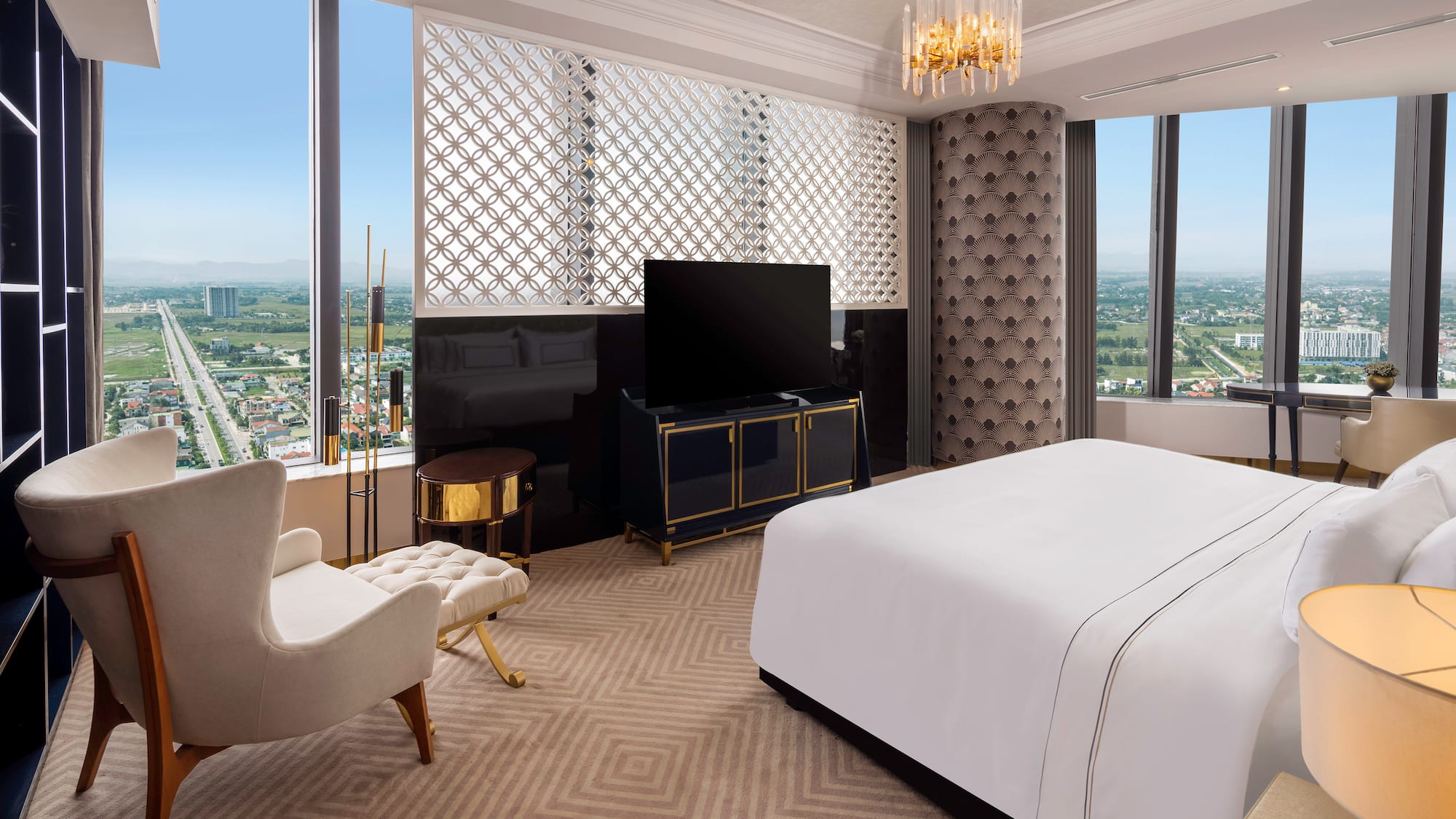 a room with a bed and a television