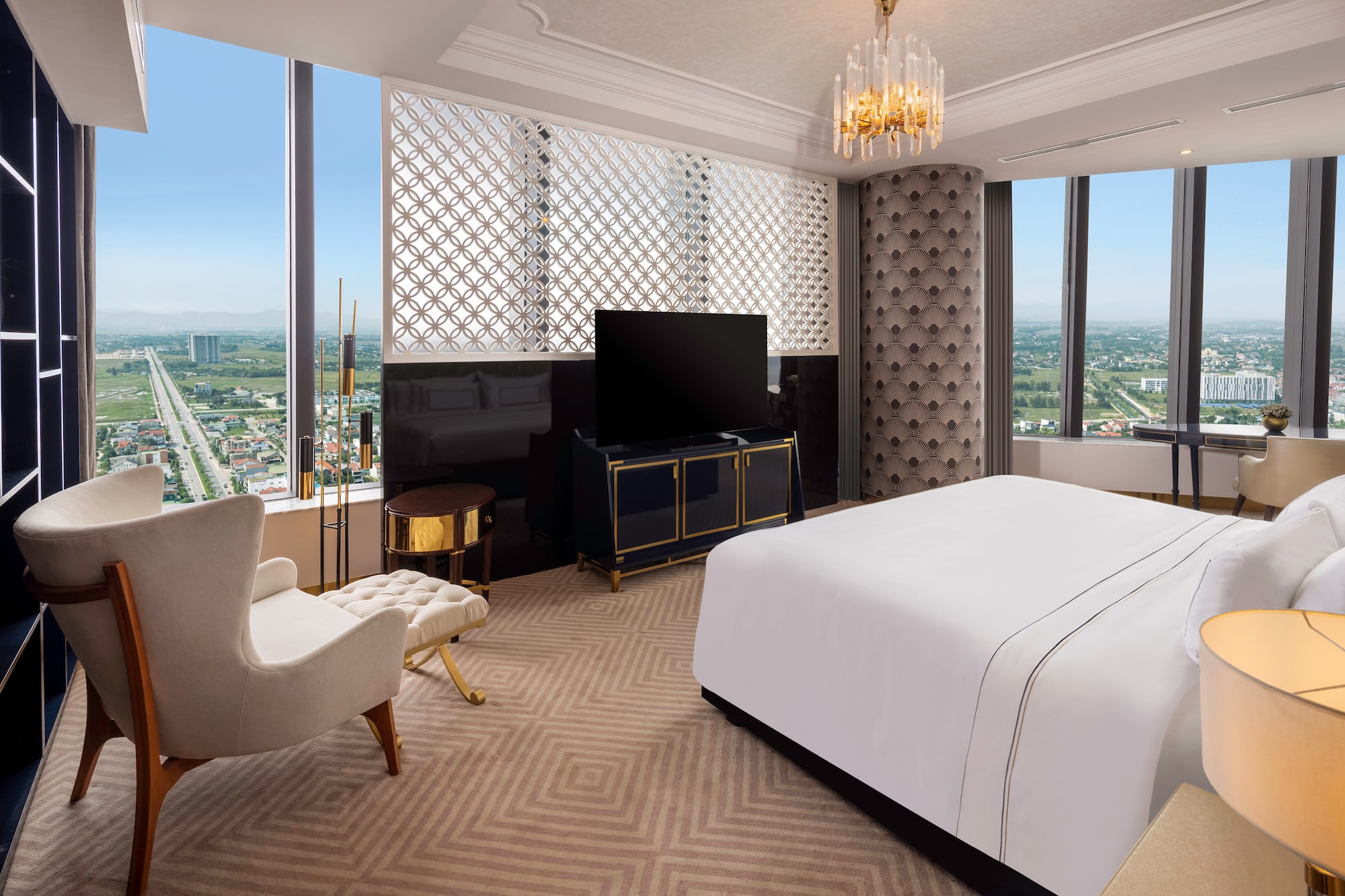 a room with a bed and a television