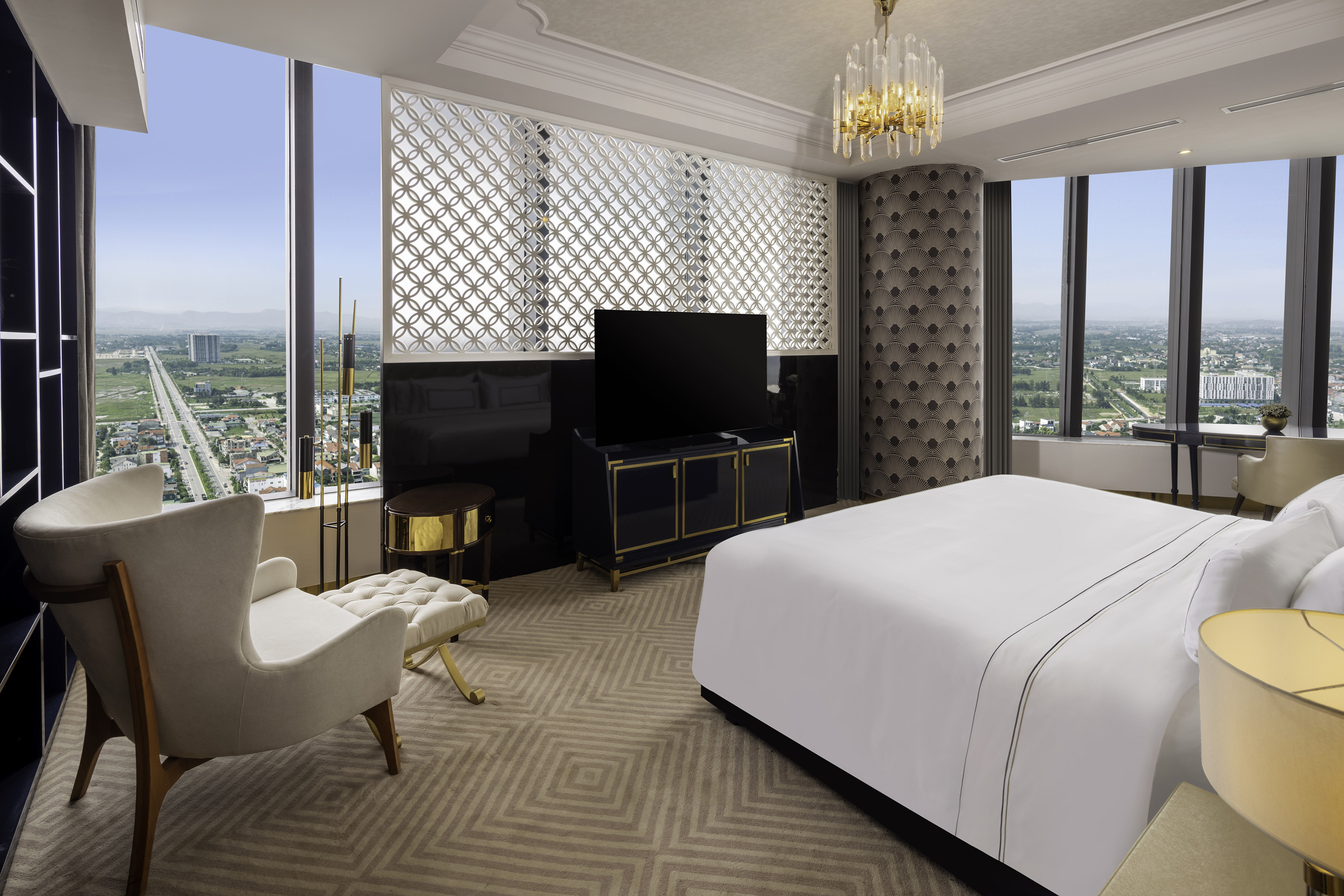 a room with a bed and a television
